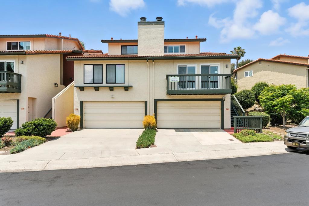Beautifully updated 3-bed, 3-bath spacious end-unit townhome in Fashion Park Villas with 1,923 sq ft of light-filled living space. Features include vaulted ceilings, updated solid surface flooring, a modern kitchen with quartz counters, stainless appliances, and two wine fridges. One bedroom and full bath are on the main level; upstairs offers two more bedrooms including a spacious primary suite with dual sinks, soaking tub, and separate shower. Private tiled patio, direct greenbelt access, upstairs laundry, and attached oversize 2-car garage and storage area. Community pool and tennis. Minutes to Fashion Valley, parks, golf, and freeways.