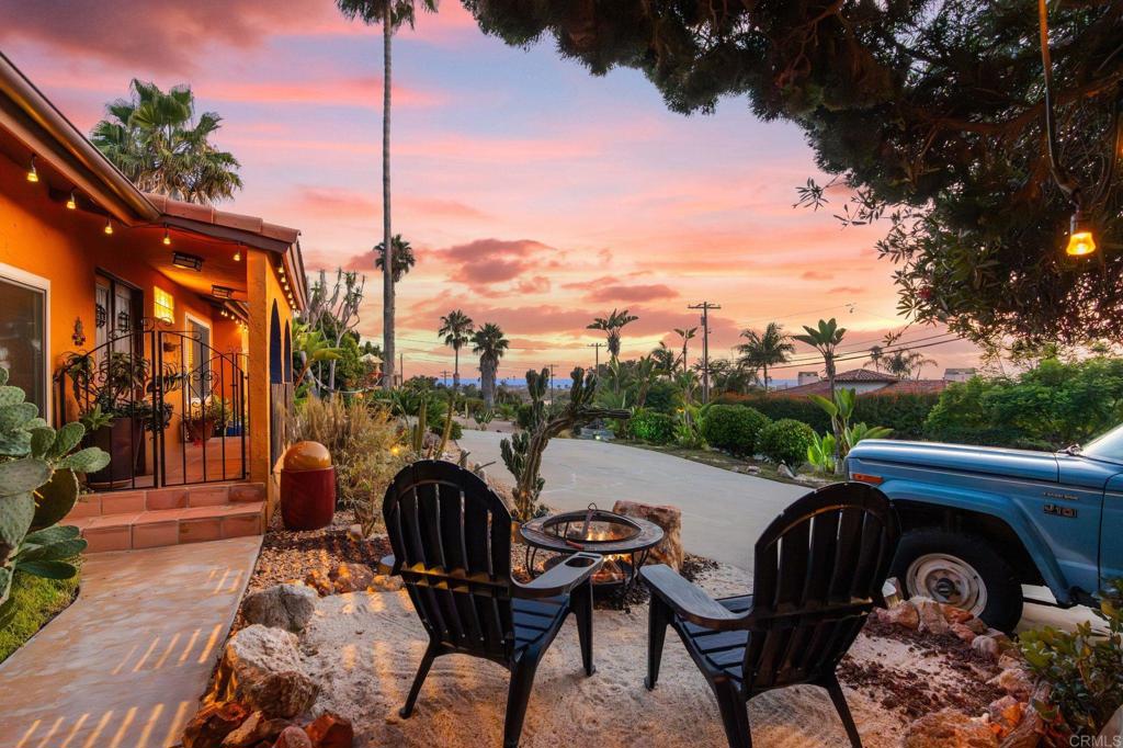 Embrace the unique vibe of Encinitas, where panoramic ocean views meet a coastal lifestyle less than half a mile from the beach. Masterfully constructed by renowned local builder, Michael Shores, this ranch-style home captures sweeping vistas from every west-facing room, bringing ocean views and daily sunsets right into your living space. Adjacent to Orpheus Park, this home is just minutes from downtown Encinitas, the PCH/101 corridor, Paul Ecke Central Elementary and the Sunday Leucadia Farmers Market. This location offers the perfect balance of beach-town charm and everyday convenience. Inside, natural light pours through large windows, highlighting the warmth of Saltillo tile and the dramatic 18-foot wood-beamed ceiling in the great room and dining room. Two fireplaces provide a cozy and inviting ambiance as the seasons change. The main home offers two en-suite bedrooms and two bathrooms, complemented by an attached casita. Equipped with its own entrance and patio with ocean view, kitchen, living space, bedroom and full bathroom with jacuzzi shower, this casita is perfect for guests, multigenerational living, or rental opportunities. Step outside to a private backyard oasis complete with a jacuzzi spa, 7-tier pondless waterfall, deck and raised garden bed, a serene retreat after a day at the beach. Custom smart, solar powered lighting and thoughtfully designed drought tolerant landscaping create a scenic backdrop for breathtaking sunset views. A spacious two-car garage further enhances the lifestyle this property offers. Blending ranch-style living with coastal charm, this property sits just minutes from sandy beaches and the vibrant heart of Encinitas!