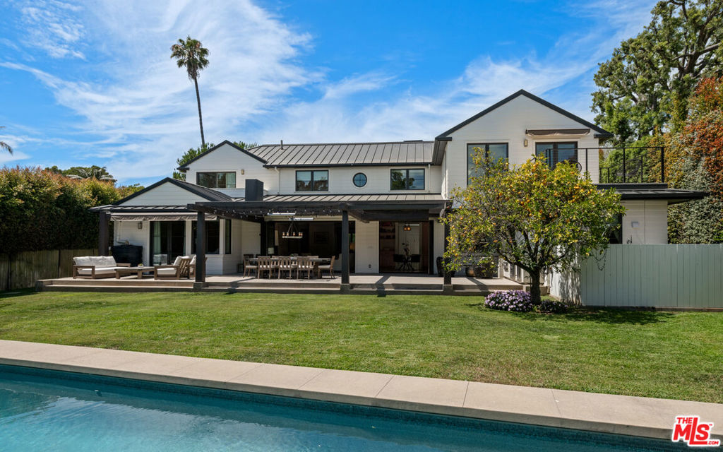 Located in the exclusive Riviera of Pacific Palisades, this 2018 custom-built traditional home offers 7,800 sq ft of refined living with seven en-suite bedrooms (2 primaries) and nine baths on a 13,656 sq ft lot. A newly renovated salt water pool and expansive grassy yard create an ideal setting for entertaining or play. Inside, designer finishes pair with Control4 home automation, Lutron lighting, recessed speakers, and integrated security cameras. The upstairs primary suite features a spa-like bath with sauna and a custom walk-in closet. Recent upgrades, including whole-house carbon microfiltration and reverse-osmosis systems, ensure this meticulously maintained residence is move-in ready in one of Los Angeles' most coveted enclaves.