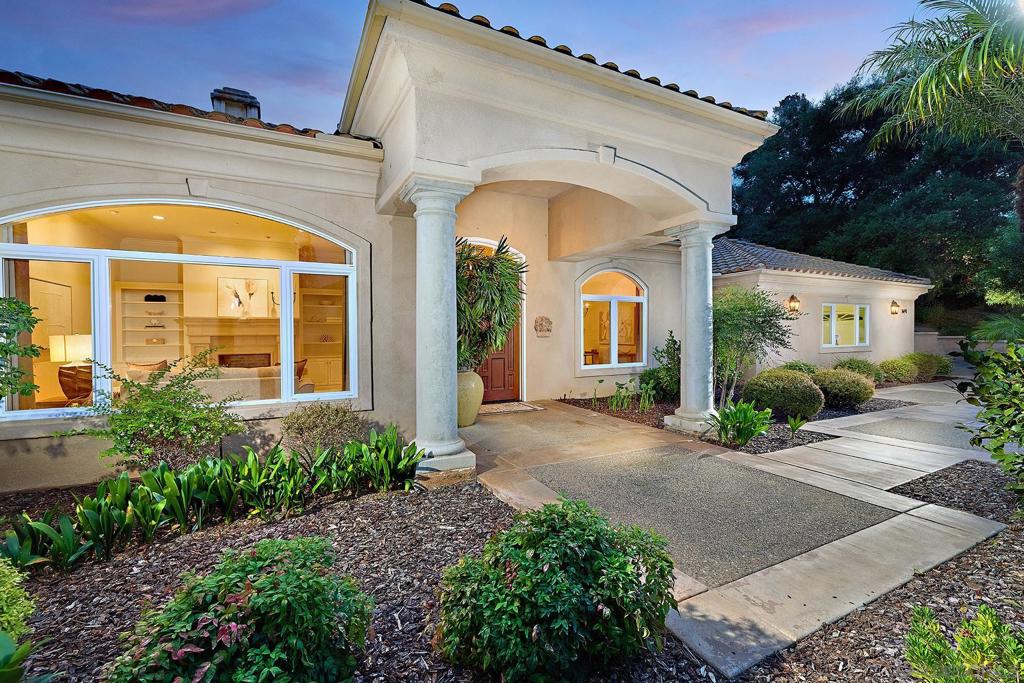 Serene single-level living awaits in picturesque Fallbrook adjacent to the Pala Mesa Golf Course and minutes to highway access, yet a world apart in an exceptionally tranquil setting! This beautifully maintained gated sanctuary exudes pride of ownership and offers an expansive 3,315 sf of living space that blends comfort with soaring ceilings and custom finishes. Built in 2000, the property offers outstanding craftsmanship and a timeless design. An open, inviting open floor plan and generous room sizes create a spacious, welcoming ambiance. Enjoy lovely formal spaces plus an option for an executive office with fireplace, 3 spacious bedrooms, including a primary suite, and 2.5 bathrooms. This impressive home is equally versatile as an entertaining hub or tranquil refuge with a well-appointed kitchen offering modern appliances and ample space for culinary creativity. Vast windows throughout stream in natural light, enhancing the interiors. Situated on a sprawling 34,848 sf (.80 acre) lot with no neighbors to the south and convenient access to local amenities, schools, and recreational opportunities. Discover the sought-after Fallbrook lifestyle for yourself in this special offering!