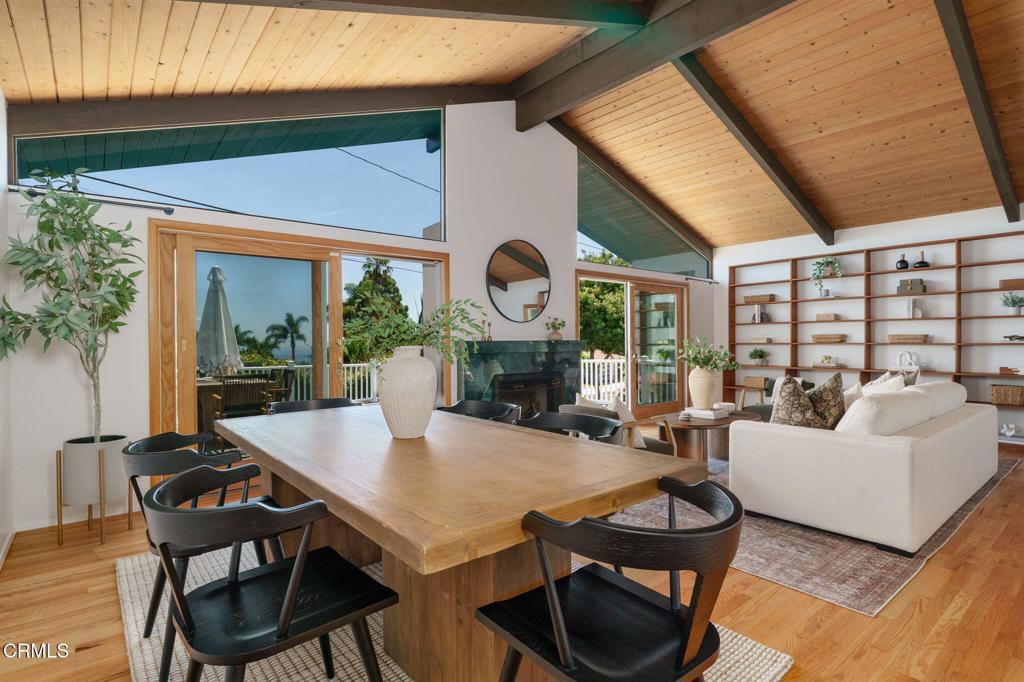 Perched in Santa Barbara's coveted Mesa neighborhood, 1749 La Coronilla offers a bright and breezy 4-bedroom + office, 2.5-bath retreat with timeless mid-century appeal. Inside, warm wood-toned floors and soaring wood-beamed ceilings create an inviting and spacious atmosphere. The flexible floor plan includes a large downstairs flex room--ideal as a fifth bedroom, family room, or creative studio. Step outside to a generous entertainment deck with stunning ocean and island views, plus a wraparound porch and grassy front yard ready to be reimagined. A detached 2-car garage at street level and oversized driveway add everyday convenience to this coastal gem. Just minutes from beaches, shopping, and Santa Barbara local favorites, this Mesa home blends character, functionality, and lifestyle.