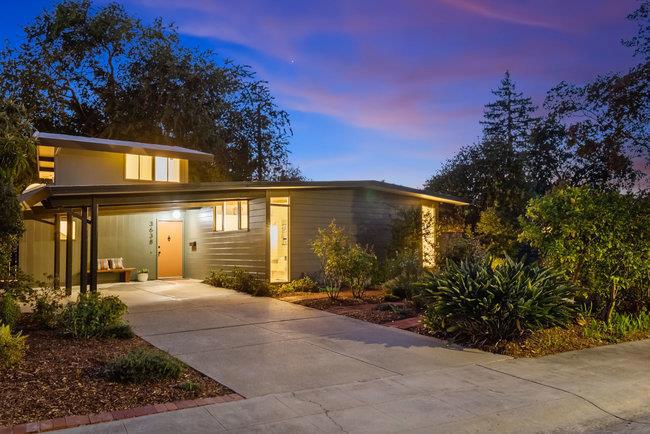 Located in the desirable Circles neighborhood of Palo Alto, this Eichler home blends iconic mid-century modern architecture with timeless indoor-outdoor living. Set on a quiet street, the property invites creativity and comfort with its clean lines, walls of glass, and seamless connection to the outdoors.The kitchen offers ample space to design your ideal chefs workspace, opening to a dining area that flows into the living room. At the heart of the home, a two-sided fireplace anchors both the living area and adjacent family room, each with sliding glass doors leading to the backyard. The spacious primary bedroom features two walk-in closets, wool berber carpeting and direct access to a private courtyard with patio and lush, mature plantings. Two additional bedrooms and skylit bathrooms complete the living area. A semi-detached bonus space offers flexibility for a home office, workshop, or extra storage. Amenities include radiant heat, a foam roof, fresh interior and exterior paint, and new wool Berber carpeting. In true Eichler fashion, the home is set among its natural scape with wraparound gardens. Near top-rated Palo Alto schools, parks, and shopping, this home combines Eichler's signature style with a prime Palo Alto location, the ideal setting for your next chapter.
