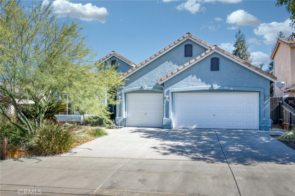 This beautiful 3bd, 2ba home offers 2,000sf of refined living on a 6,500sf lot with excellent curb appeal and a 3-car garage, all nestled near Fort Washington Golf & Country Club. The front landscaping was thoughtfully curated by the seller, with a hand-selected tree and accompanying plants designed for seasonal texture and colors. Inside, the open-concept layout blends functionality with warmth, featuring soaring ceilings, abundant natural light, and spacious formal and casual dining areas. The kitchen sits at the heart of the home, offering rich cabinetry, counter seating, and seamless flow to the living room—ideal for entertaining. A flexible space between the living room and primary bedroom offers the perfect spot for a desk, lounge chair, or display console. The beautiful primary suite continues the flow with French doors, a spa-like bath, dual sinks, soaking tub, and glass-enclosed shower. This meticulously maintained home also includes current pest and roof certifications. Situated near Millbrook & Copper with access to Woodward Park trails. Clovis Unified: Fugman, Granite Ridge, and Clovis North.