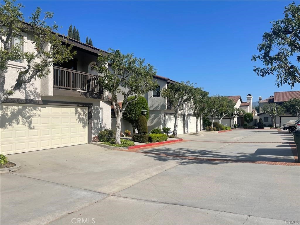 Beautiful private TOWNHOME in the Gated Cypress Place community in Covina. This Townhome (PUD) has been recently remodeled. This unit is also an END UNIT Featuring 3 large bedrooms and 2 1/2 Bathrooms. Bonus room downstairs can be used to create additional bedroom/office/playroom or library. Double Car garage with direct access to home. Living space offers 1,879 Sq. Ft. Travertine flooring, LED lighting, newer kitchen cabinets, granite counters, mosaic back splash, stainless appliances. All baths have been fully updated with newer vanities, toilets, mirrors, travertine flooring, granite counters, sinks/faucets. Indoor laundry room, study/homework nook & folding station are conveniently located upstairs. New Heating and AC. Easily accessible to commuter friendly 57, 210 or 10 fwys. Conveniently near shopping and restaurants. If Safety, Security and Tranquility are your concerns - this is definitely the home for you!