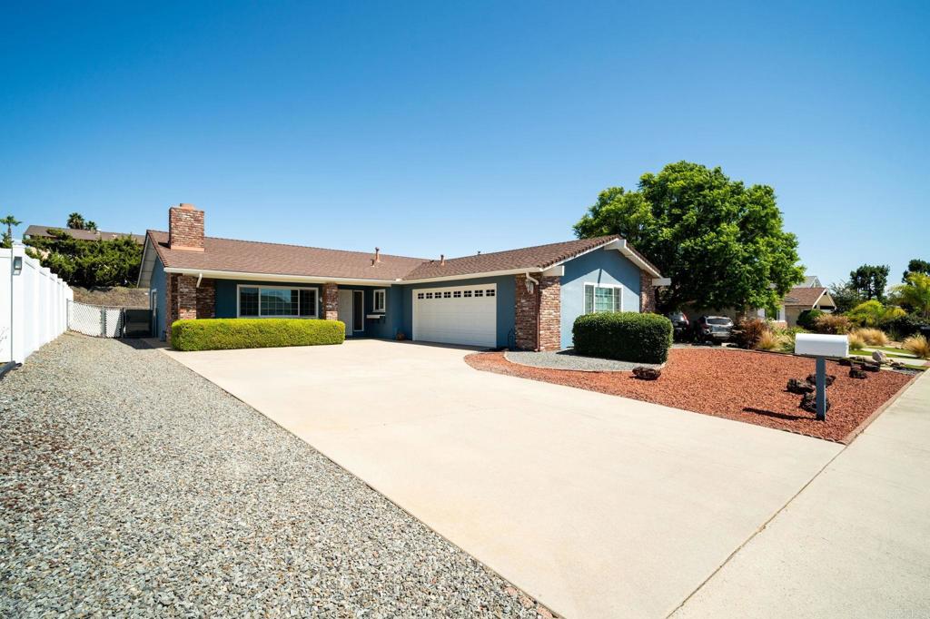 Discover easy living in this inviting 2 bedroom, 2 bathroom single-story home located in the highly desirable Escondido Country Club community. Designed for comfort and convenience, this home blends thoughtful updates with a low-maintenance lifestyle. Inside, you’ll find dual pane windows, blinds throughout, and two sliding glass doors leading to the private backyard. A cozy fireplace anchors the living room, while ceiling fans and central A/C ensure year-round comfort. The spacious primary suite includes two closets, and the home offers abundant storage space throughout. Enjoy the convenience of an indoor laundry room with sink, a 2-car garage, and a large driveway for extra parking. Outdoor living is easy with a large covered patio, vinyl fencing on one side, and low-maintenance landscaping in both the front and backyard. Perfectly situated in a desirable neighborhood, this home combines comfort, functionality, and value—ready for its next owner to make it their own! Some of the photos are virtually staged.