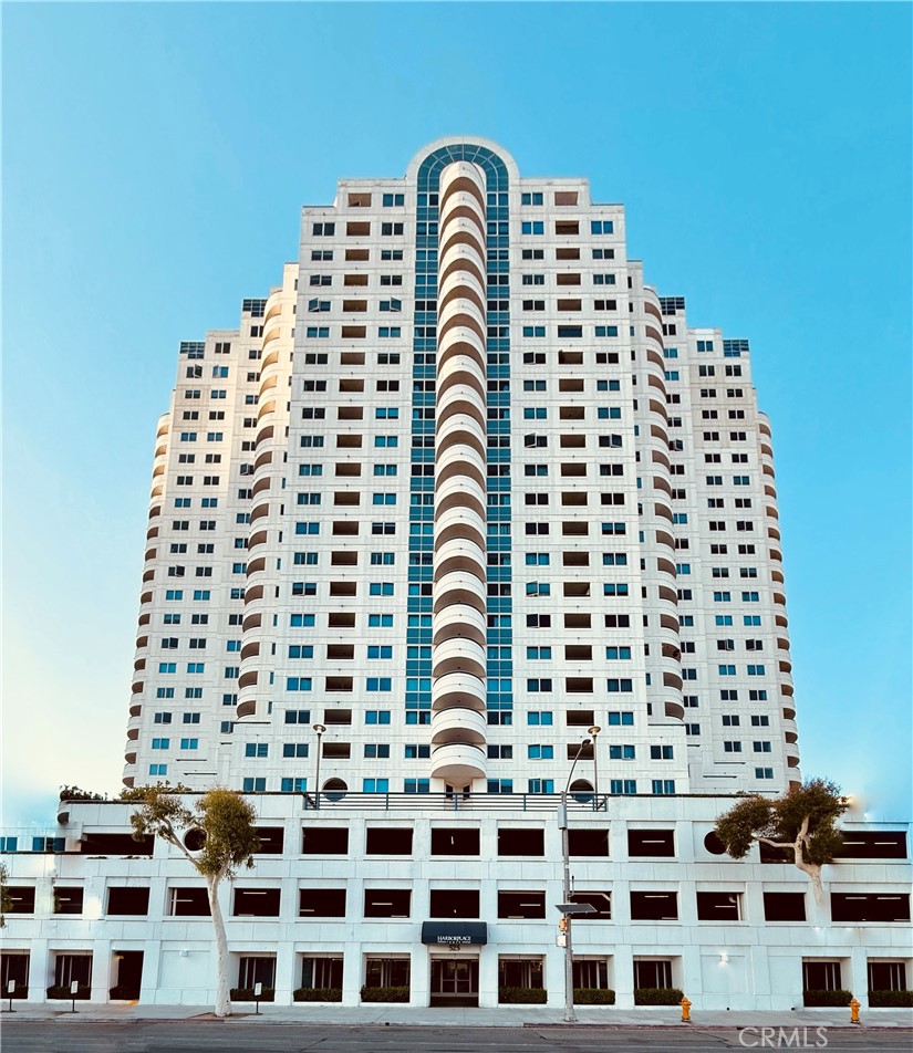 Discover the exceptional lifestyle you've always dreamed of in this premier two-bedroom, two-bath condominium at the luxurious Harbor Place Tower. Located in the vibrant heart of Downtown Long Beach, this residence offers a sophisticated living experience with breathtaking ocean and city views, Step into a bright, open-concept floor plan designed for modern living. Both bedrooms are adorned with large glass windows, perfectly framing panoramic views of the Pacific Ocean and the iconic Queen Mary, complete with a private balcony for enjoying the coastal breeze. The modern kitchen boasts granite countertops, stainless-steel appliances, ample cabinet space, and a convenient breakfast bar. The spacious primary suite features two sets of mirrored closets and an en-suite bathroom with an oversized tub, separate walk-in shower, and dual vanities. For added convenience, it comes with a washer/dryer tucked inside the closet and two assigned deeded tandem parking spaces. Harbor Place Tower offers a comprehensive suite of resort-style amenities, transforming your daily life into a vacation. Enjoy a refreshing swim in the pool and spa, relax by the outdoor lounge with a cozy fireplace, or host gatherings at the built-in BBQ facilities. Stay active in the fully equipped fitness center and unwind in the sauna room, hold meetings at the conference room. Plus, with 24/7 concierge and on-site security, your peace of mind is assured. A standout feature is the ocean-facing balcony, an ideal spot for entertaining and observing major events like the Grand Prix. This property's strategic location puts you at the center of it all. Enjoy the convenience of close proximity with easy access to the Convention Center, The Pike, the beach, the marina, and major transportation routes. With the forthcoming 2028 Olympic Games, this residence presents a unique opportunity to be perfectly positioned in a world-class event hub.