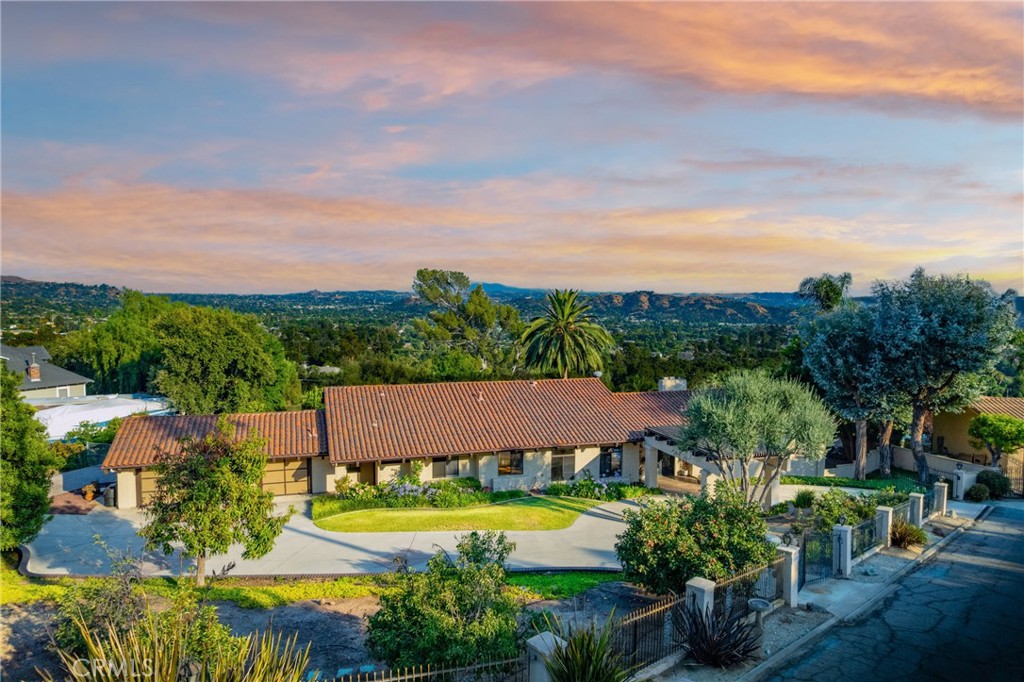 Elegant Spanish-Style Estate with Sweeping Views, Lush Grounds & Private ADU in Glendora
Nestled in the prestigious foothills of Glendora, this spectacular Spanish-style estate blends timeless architecture with modern luxury across a beautifully landscaped 1.371-acre lot. With over 4,287 sq. ft. of meticulously designed living space—including a separate, private ADU—this one-of-a-kind property offers space, privacy, and panoramic views of the San Gabriel Valley.
A custom iron front door welcomes you into a grand interior featuring a formal living room, formal dining room, and a dedicated home office. The spacious kitchen is equipped with granite countertops, a center island, recessed lighting, a built-in refrigerator, mini fridge, and trash compactor—designed with both functionality and entertaining in mind. The upstairs hosts four generously sized bedrooms, including a luxurious primary suite with a walk-in closet and direct access to a second-story balcony, perfect for taking in the views.
Step outside to your newly remodeled backyard oasis—complete with a beautiful pool and spa, covered patio with built-in BBQ, elegant pavers, and a full irrigation and sprinkler system. A front portico with a three-tier fountain sets a welcoming tone, while the extensive landscaping includes 25+ varieties of rose bushes and an impressive collection of fruit and nut trees: macadamia, almond, mango, pomegranate, Anna and Granny Smith apples, peach, pear, persimmon, orange, tangerine, lemon, lime, grapefruit, Meyer lemon, plum, pluot, avocado, blackberry, and boysenberry.
A unique highlight of the property is the fully independent ADU, offering its own living room with fireplace, bedroom, office/gym, full kitchen, private entrance, and separate HVAC system—ideal for extended family, guests, or rental potential.
Three separate driveway entrances, a circular driveway, and a spacious three-car attached garage provide ample parking and convenience.