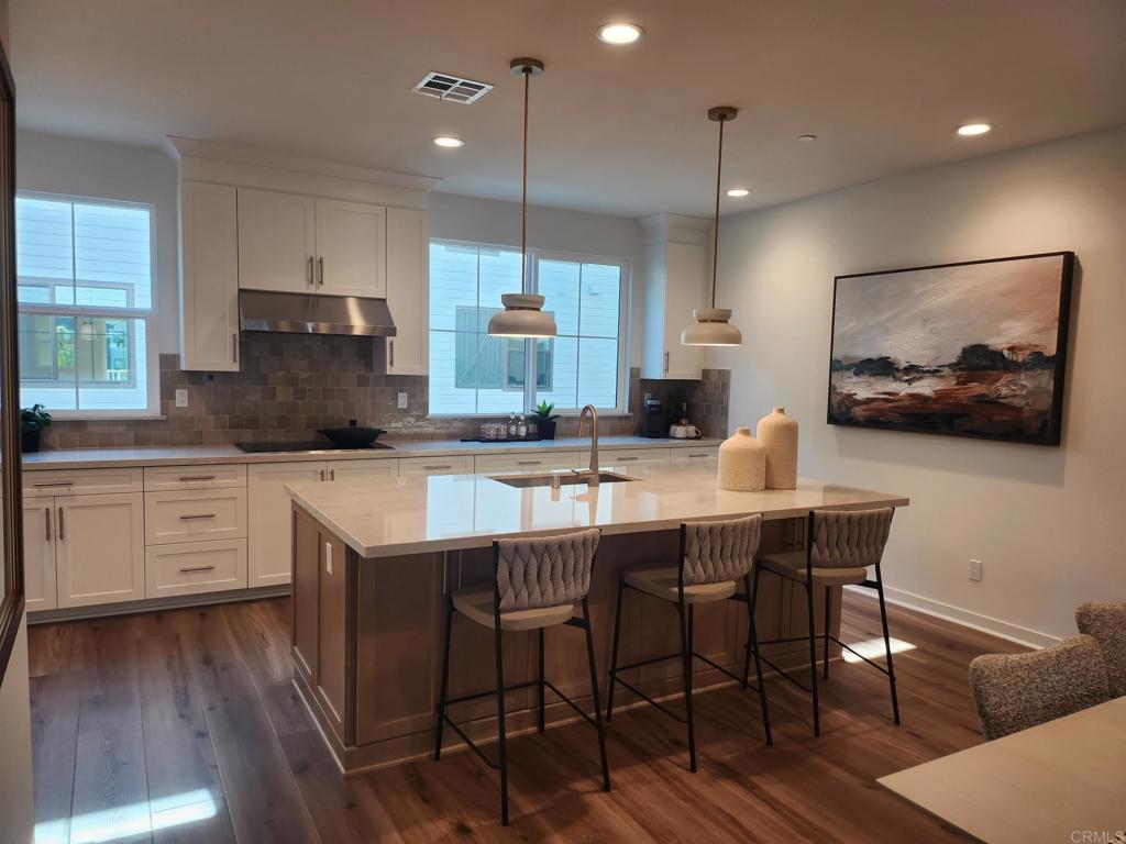 Modern Coastal Living – Live the ultimate Carlsbad lifestyle in this beautifully upgraded 4-bedroom, 3.5-bathroom home offering 2,070 sq ft of light-filled, open-concept living in a prime location. The gourmet kitchen features Wolf appliances, quartz countertops, and shaker-style soft-close cabinetry, blending luxury and function. A spacious layout includes a private downstairs bedroom with en-suite bath, ideal for guests or multi-gen living. Additional upgrades include owned solar and a 2-car garage with EV charger. Enjoy incredible access to the outdoors — walk to Agua Hedionda Lagoon for paddleboarding, kayaking, or swimming, and hop on your e-bike to catch waves at Tamarack Beach, just minutes away. The community offers resort-style amenities including a pool, hot tub, dog park, and playground, and you’re surrounded by top-rated Carlsbad schools, coastal trails, shopping, dining, and more. Luxury finishes, unbeatable location, and a true coastal lifestyle — Welcome home to 2536 Elderberry Ln.