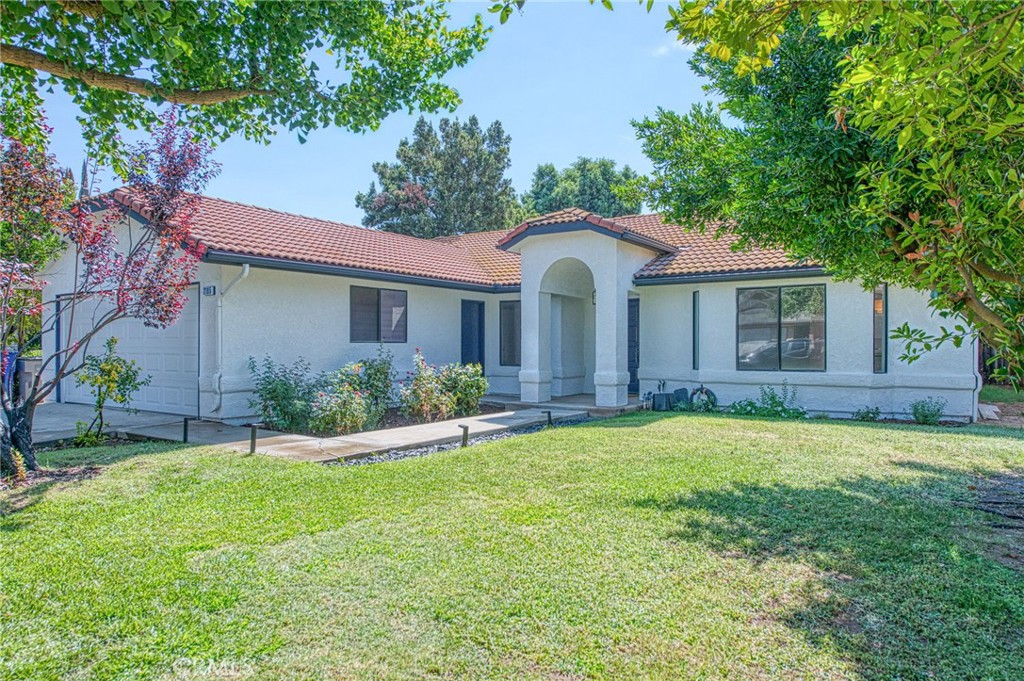 Completely renovated 3-bedroom, 2-bathroom home in desirable Clovis Unified School District (Clovis North High School). This 1,596 square foot single-story residence features luxury waterproof vinyl flooring throughout, quartz countertops in kitchen and both bathrooms, and stainless steel appliances.
The open-concept living area showcases vaulted ceilings with exposed beams and a fireplace as the focal point. The fully remodeled kitchen has been enlarged both in length and height, offering exceptional storage with white shaker cabinets that extend to the ceiling after soffit removal. Premium LG stainless steel appliances include a counter-depth refrigerator. The expanded kitchen flows seamlessly into the dining area through an opened wall, creating an enhanced open-concept design that extends to the sliding door. The primary suite includes a walk-in closet and spa-like bathroom with dual vanities and an oversized tiled shower with ceiling-mounted rain shower head.
Recent updates include fresh interior and exterior paint, complete popcorn ceiling removal, new light fixtures and ceiling fans throughout, new water heater, and completely remodeled bathrooms. The property sits on a manicured lot with established landscaping and features a durable tile roof. Move-in ready condition with contemporary finishes and thoughtful design details throughout.
Some photos have been virtually staged.