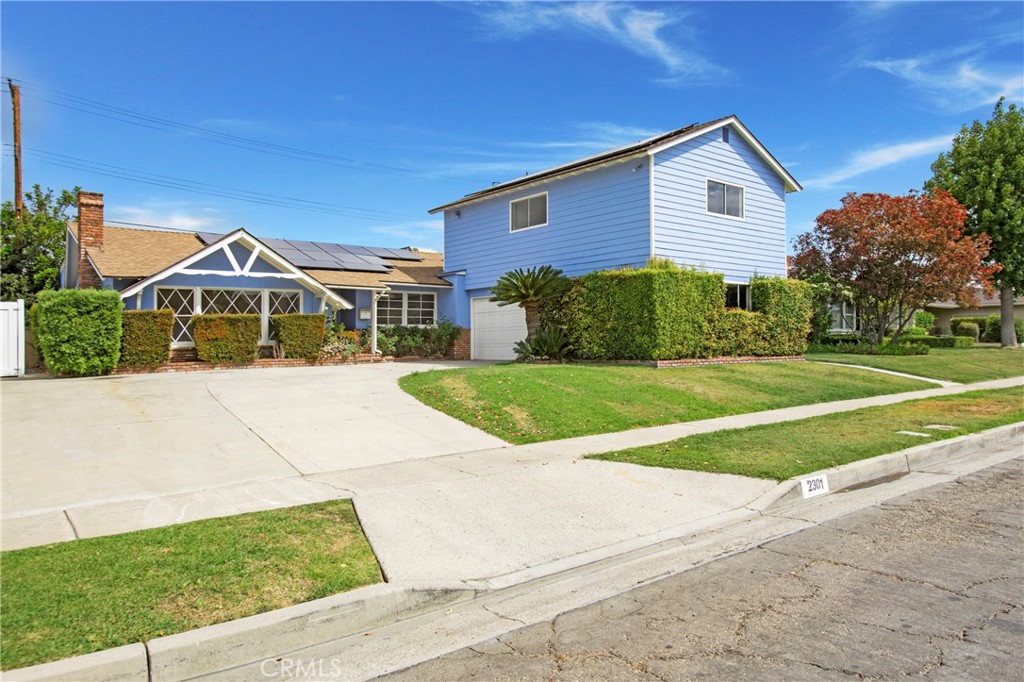Great home and located in the highly desirable Troy High School District! You will find PLENTY of living space here for a great price...2845 square feet of living space, per the tax assessor. Along with the ample space are some very unique features that make this home one-of-a-kind. There are currently 3 bedrooms and 3 bathrooms PLUS a skylighted den. (The home is listed as a 4 bedroom on the tax records, but conversions were made and the 4th bedroom is now the den.) Enter the main floor of the home through a quaint covered porch and step into a spacious living room with original HARDWOOD plank floors, an oversized front cottage window and a fireplace. Adjacent to the living room is a spacious kitchen with a large eat-in dining space and original hardwood plank floors. The primary suite and bathroom, den and laundry room are also located on the main floor, along with the large music/sound recording studio with (3) separate work spaces and an attached bathroom. Music or sound recording aren't your "thing"? No problem, use your creativity here to convert this LARGE space into a spectacular Home Gym, a Home Theatre, a Game Room, a Home-based Business Hub or...add windows and turn it into a very large primary bedroom suite with retreat. OR...drumroll please...add windows and a kitchenette and turn it into an ADU (Check with the city building department first, of course) and rent it out to one of the many local CSU Fullerton students. There are so many options and great potential here! Head upstairs to find the two additional oversized bedrooms (with free-standing closets) and the 3rd bathroom. The two-car garage is attached and expanded with a large extended work/storage area that is perfect as a hobby space, a workshop or just extra space to store your bikes, trikes, boxes and more. Most of the interior of the home was just freshly painted, the AC was replaced in 2020 and the Solar was installed in 2021. Seller has recently added canned lights to the primary bedroom, den and hallway as well. It is walking distance to Cal State Fullerton and to Troy High School. It's close to Acacia Elementary and Rosary Academy too. Nice home, great price and ready to become a perfect fit for YOU.