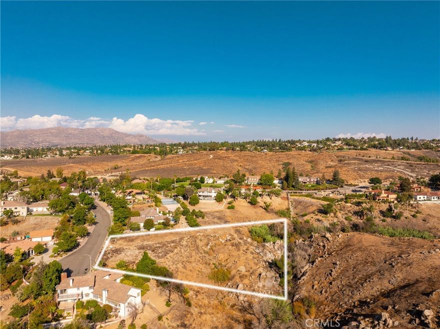 Discover the rare opportunity to own 1.39 acres in one of Riverside’s most sought-after neighborhoods. Located on Ranch View Rd in the prestigious Alessandro Heights/Hawarden Hills area, this vacant parcel is zoned R-1 (Residential Acreage), offering an incredible setting to design and build your dream estate. Surrounded by custom homes and nestled at the end of a cul-de-sac, the property provides privacy, serenity, and scenic views of the surrounding hillsides. The lot has already been graded with a generous building pad, giving you a head start on your vision. Utilities are located nearby with water and electric service accessible (buyer to verify all connections). Zoning allows for a single-family residence, ensuring a neighborhood of estate style homes on expansive lots. The possibilities are endless, design a sprawling single-story ranch, a luxury two-story retreat, or a home with resort-style amenities such as a pool, outdoor living spaces, and guest casita. The size of the property also allows room for RV parking, hobby spaces, or personalized landscaping such as orchards, vineyards, or gardens. This property offers the perfect balance of rural tranquility and convenience. While tucked away in a quiet, exclusive enclave, you’re just minutes from shopping, dining, freeway access, and top rated schools. It’s a location that blends lifestyle, privacy, and long term value. Buyers are strongly encouraged to perform due diligence with the City of Riverside regarding permitted uses, utility connections, building requirements, and any updated codes or hillside development standards. Seize this chance to create a custom home that reflects your vision and lifestyle. 6944 Ranch View Rd is more than just land it’s a canvas for your dream estate.
