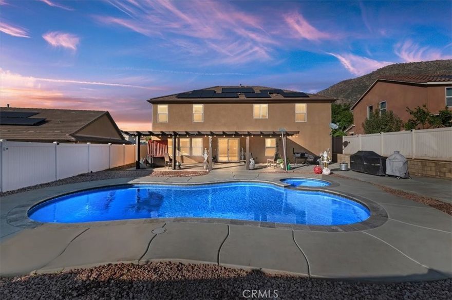 Welcome to this spacious two-story home located in the highly desirable Spring Mountain Ranch neighborhood of Riverside. Offering 2,923 sq ft of living space, this well-designed residence features 5 bedrooms and 3 bathrooms, including a convenient downstairs bedroom and full bathroom, ideal for guests, extended family, or a private home office.

Enjoy California living at its best with a heated pool and spa, perfect for year-round relaxation and entertaining. The backyard is designed for hosting, featuring a built-in grill, a covered patio that extends the full length of the home, and beautiful mountain views—an ideal setting for outdoor dining and gatherings. The home is also equipped with paid-off solar panels for energy efficiency and long-term savings, a whole-house water filtration system, and no HOA, providing added comfort, convenience, and flexibility.

The community offers a 6-acre park, scenic walking trails, and stunning mountain surroundings, creating a peaceful yet connected lifestyle. Conveniently located near UC Riverside, Loma Linda Medical School, and Downtown Riverside’s Mission Inn, with easy access to dining, shopping, and major commuter routes.

This home offers the perfect balance of space, comfort, and location—an exceptional opportunity you won’t want to miss.