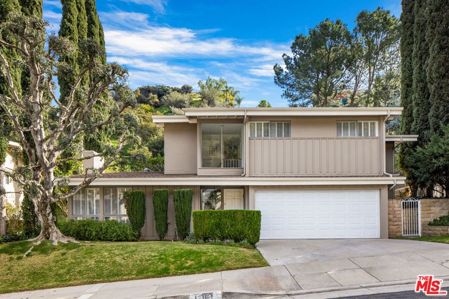 Welcome to this beautiful 4 bedroom plus office and 4 bath Contemporary home built by Harlan Lee located in the desirable Encino Hills and in located in the Lanai School District. Just staged. This home boasts an abundance of natural light, high ceilings, hardwood floors, built-ins and storage.  The recently painted interior highlights the architectural integrity of the home.  The large living room has a well-appointed fireplace that creates its own centerpiece in the room. Spacious dining room that overlooks the large backyard with lots of greenery and several fruit trees. All of which provide a private tranquil setting. Large kitchen area with plenty of storage opens into the family room with custom cabinets and space to entertain. Downstairs laundry room with great storage and bedroom with ensuite bathroom located on the first floor. The upstairs primary bedroom features vaulted ceilings, a walk-in closet, and  bath. Two additional spacious bedrooms with large closets and a full bathroom. Palatial private upstairs office/bedroom with LED lighting, picture windows with spectacular views of trees and gardens, plus built-in custom counters and cabinets to accommodate computers and printers. The two-car garage has plenty of storage and a contractor's workbench, custom lighting, hooks for your tools, and an abundance of cabinets to keep everything organized.Conveniently located to several schools, Santa Monica trails, Backbone trails, Tapia farms, restaurants, markets, and eateries. Easy access to major freeways. This home has everything to offer. There is no sign on the property.