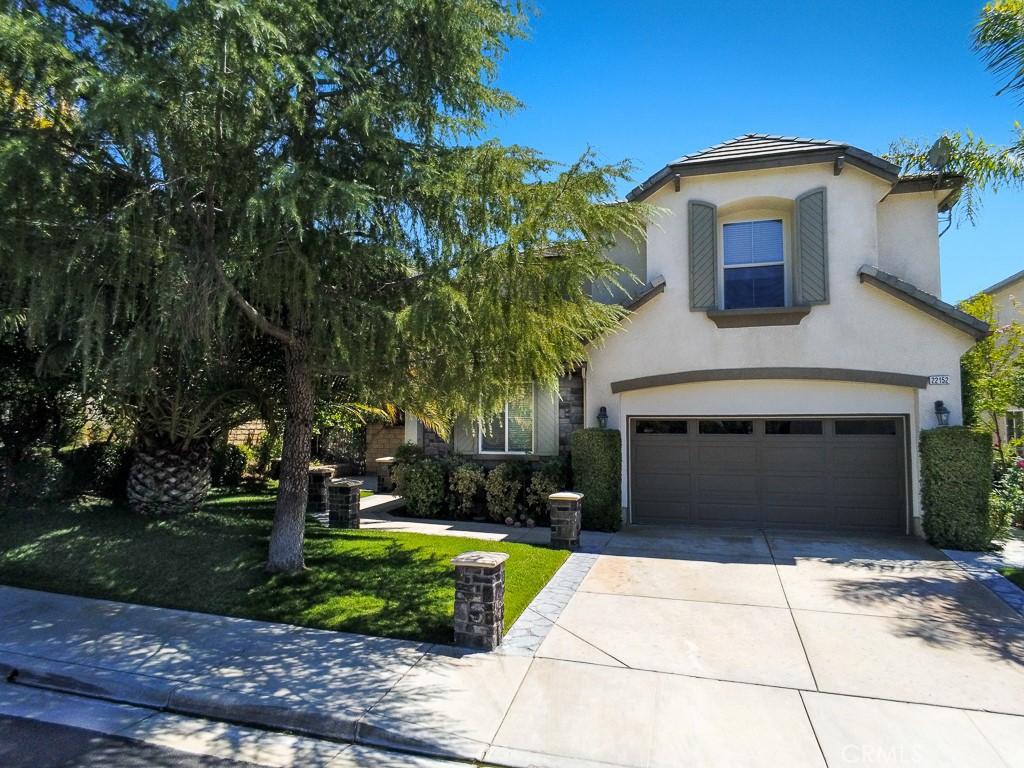 Welcome to this cozy two-story home nestled in the desirable Pacific Crest neighborhood. With 5 bedrooms and 3.5 bathrooms, this home offers ample space for both family living and entertaining. As you step inside, you’ll be greeted by a spacious living room and a formal dining room, perfect for hosting gatherings. The family room boasts high ceilings, creating an open and airy feel, while the well-appointed kitchen and convenient storage spaces make daily living a breeze. The upper level of the home features 4 bedrooms and 2 full bathrooms, providing plenty of room for family or guests. A downstairs bedroom with an adjacent full bathroom offers ideal privacy and can be used as a guest suite or home office. Plus, an additional half bath on the main level adds extra convenience. Outside, you’ll enjoy a beautifully landscaped garden and a BBQ area with a gas firepit, perfect for cozy evenings and outdoor entertainment. The lush lawn provides a serene space for relaxation or play. The tandem 3-car garage offers ample parking and additional storage options. With contemporary finishes throughout, this home blends modern comfort with a welcoming, inviting atmosphere. It’s the perfect space for anyone looking to enjoy a blend of functional living and outdoor enjoyment.