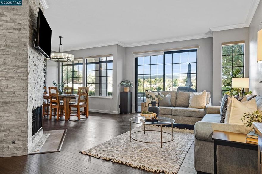 Welcome to this beautiful first-floor 2-bedroom, 2-bathroom condo in the highly sought-after gated community of Canyon Lakes in San Ramon. This beautifully remodeled single-story condo offers effortless living with stunning lake views right from your private patio. Step inside to find hardwood floors and a tastefully updated kitchen featuring modern finishes, sleek countertops, and a large walk-in pantry — perfect for the home chef.  Relax in the spa-like primary bathroom, designed with luxury and comfort in mind, or unwind by the gorgeous updated fireplace that serves as the heart of the home. Additional upgrades include a new furnace and A/C, ensuring year-round comfort and peace of mind.  Enjoy the convenience of a well-maintained community where the HOA covers water, trash, and sewer, and take advantage of the peaceful walking paths, manicured grounds, and resort-style amenities that make Canyon Lakes so desirable.  Experience serene lakefront living and modern comfort — all within minutes of top-rated schools, shopping, dining, and golf courses.