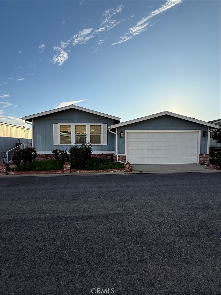 GORGEOUS 3 bedroom, 2 bathroom 1760 square foot home with AMAZING floorplan, GREAT CURB APPEAL, beautiful mountain views, located at highly desirable Oakridge gated Mobile Home Park. Property has BRAND NEW ROOF in 2024 that cost over $28,000, very nice BRAND NEW CARPET in 2 of 3 bedrooms, Wood Floors, PAINTED bedrooms, bathrooms and kitchen ceiling, Kitchen is upgraded with GRANITE COUNTERS, TONS of CABINET SPACE, LAZY SUSANS, tile backsplash, New Garbage Disposal, Large Dining Area, Huge Living Room has high vaulted ceilings, 3rd bedroom has Walk In Closet and can be used as an Office or Bedroom, Newer Double Pane Windows throughout, Huge Master Bedroom with high vaulted ceilings has private bathroom with Granite Counters, large tub to relax in, separate shower, Large Sliding Mirrored Closet Doors and very nice NEWER, excellent quality sliding glass doors lead to covered patio with incredible mountain views. Side yard is good size, 2nd bathroom also has granite counters. Central A/C, brand new Water Heater, Laundry Room with a LOT of Cabinet Space, BRAND NEW 2 CAR ATTACHED GARAGE Door and new Mechanism, front yard has beautiful Roses and automatic sprinklers. Resort Style Amenities include Pool, 2 spas, Clubhouse, Library, Billiards, Gym, Putting Green, Pickleball, picnic areas with large beautiful greenbelts, tennis, basketball, parties and events at Clubhouse, Yoga Classes, Pool Exercise Group and more, 24 hr. Security Guard, RV Storage for boats and RV, guest parking and more. Space Rent lower than most Homes and Rent Control is HUGE PLUS.