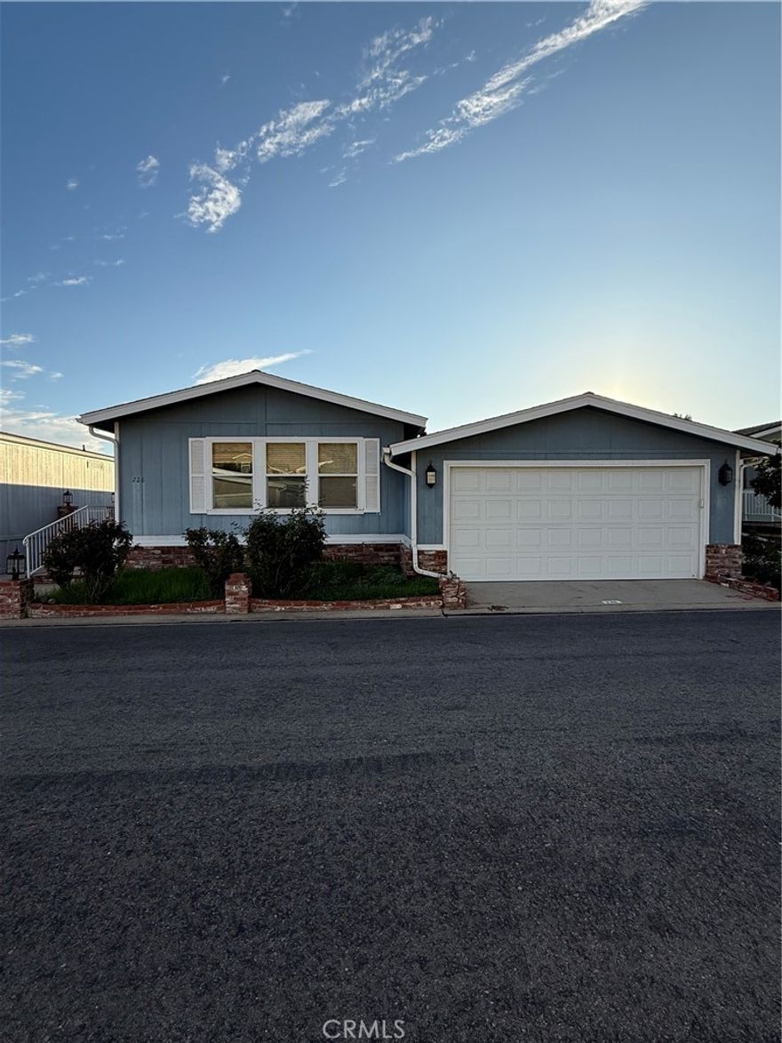 GORGEOUS 3 bedroom, 2 bathroom 1760 square foot home with AMAZING floorplan, GREAT CURB APPEAL, beautiful mountain views, located at highly desirable Oakridge gated Mobile Home Park. Property has BRAND NEW ROOF in 2024 that cost over $28,000, very nice BRAND NEW CARPET in 2 of 3 bedrooms, Wood Floors, PAINTED bedrooms, bathrooms and kitchen ceiling, Kitchen is upgraded with GRANITE COUNTERS, TONS of CABINET SPACE, LAZY SUSANS, tile backsplash, New Garbage Disposal, Large Dining Area, Huge Living Room has high vaulted ceilings, 3rd bedroom has Walk In Closet and can be used as an Office or Bedroom, Newer Double Pane Windows throughout, Huge Master Bedroom with high vaulted ceilings has private bathroom with Granite Counters, large tub to relax in, separate shower, Large Sliding Mirrored Closet Doors and very nice NEWER, excellent quality sliding glass doors lead to covered patio with incredible mountain views. Side yard is good size, 2nd bathroom also has granite counters. Central A/C, brand new Water Heater, Laundry Room with a LOT of Cabinet Space, BRAND NEW 2 CAR ATTACHED GARAGE Door and new Mechanism, front yard has beautiful Roses and automatic sprinklers. Resort Style Amenities include Pool, 2 spas, Clubhouse, Library, Billiards, Gym, Putting Green, Pickleball, picnic areas with large beautiful greenbelts, tennis, basketball, parties and events at Clubhouse, Yoga Classes, Pool Exercise Group and more, 24 hr. Security Guard, RV Storage for boats and RV, guest parking and more. Space Rent lower than most Homes and Rent Control is HUGE PLUS.