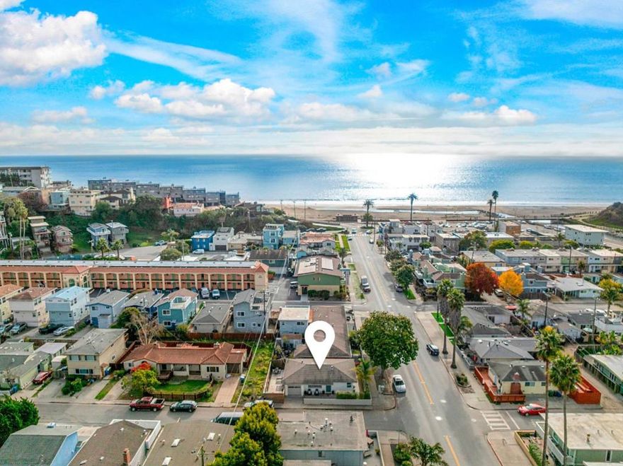 When was the last time you woke up and heard the ocean before you even opened your eyes? The kind of morning where the light filters in just right, the air smells faintly of salt, and for a second, you forget what day it is because here, it doesnt matter. This home makes everyday life feel a little slower, a little more intentional. The new floors underfoot and freshly painted walls give the space a renewed feeling thats simple, thoughtful, and meant to be lived in. Maybe its a quiet morning with coffee and a playlist that fits the mood. Maybe its a dinner that turns into laughter that turns into stories that stretch long into the night. Step outside and youll find your own pocket of peace, a patio tucked behind hedges that keep the world at a polite distance. Its where conversations happen unhurried and where you remember how good it feels to just be still. And when you're ready to move again, the beach is right there, waiting for barefoot walks, salty hair, and sunsets that make you stay just a little longer than planned. Because this isnt just where you live. Its how you live.