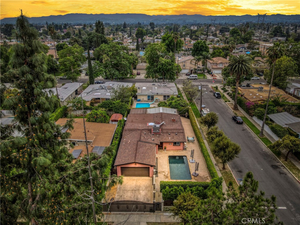 Now Offering Seller-Paid Closing Cost or Rate Buy Down Incentives — A Great Opportunity for Buyers!
Welcome to this stunning 3-bedroom, 2.5-bathroom retreat boasting 2,000+ sq. ft. of beautifully designed living space! Nestled on a private corner lot in a double cul-de-sac street, this gem is just outside of Northridge, offering the perfect mix of tranquility and convenience. Step into your own private oasis, where a dark-bottom sparkling pool, vine-covered walls, and a low-maintenance yard with stamped concrete and artificial turf create a serene escape. Inside, you’ll be captivated by the soaring vaulted ceilings and light-filled spaces that make this home feel both grand and inviting. The gourmet kitchen is a chef’s dream, featuring a Viking range, pot filler, custom cabinetry, granite countertops, and a stylish breakfast bar. The open-concept design flows effortlessly into the bright living and dining area, warmed by a double-sided fireplace, while the adjacent family room with wood floors and French doors opens to a covered outdoor space, perfect for year-round entertaining. The spacious primary suite is a true retreat, complete with a luxurious en-suite bath and walk-in closet. Two additional well-sized bedrooms offer wood flooring, and both bathrooms showcase custom tilework and sky tubes for added natural light. A separate laundry room attached to the garage adds extra convenience. This home is an absolute showstopper, blending elegance, comfort, and practicality in a sought-after neighborhood. Don’t miss this incredible opportunity—schedule your showing today.