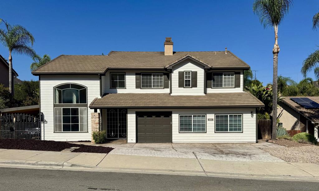 Beautiful Two-Story Home Backing to Nature Preserve in Hidden Escondido Neighborhood with no HOA! Walk to Daley Ranch & Dixon Lake and enjoy a variety of activites. Tucked away in a quiet community in Escondido, this spacious 4-bedroom, 3 full bathroom home offers the perfect blend of privacy and convenience. Backing directly to a serene nature preserve and creek, you’ll enjoy peaceful views with no rear neighbors. Step inside to soaring 16-foot vaulted ceilings in the living room, dining area, and kitchen, creating an open and airy feel throughout the main living space. The kitchen features granite countertops, stainless steel appliances including a built-in microwave, dishwasher, and range/oven and offers both functionality and style. The first floor boasts durable laminate wood flooring with one bedroom on main floor! The upstairs is comfortably carpeted. The primary suite has vaulted ceilings with a balcony attached to enjoy your serene surroundings. Washer and dryer hookups are included, along with central air conditioning for year-round comfort. Sitting on a generous 12,000+ sq ft lot, there’s plenty of space to add a pool or customize your backyard retreat. A permitted bonus room offers extra flexibility ideal for a game room, playroom, home office, or media room. Conveniently located just minutes from Hwy 78 and I-15, this home offers both seclusion and accessibility.
