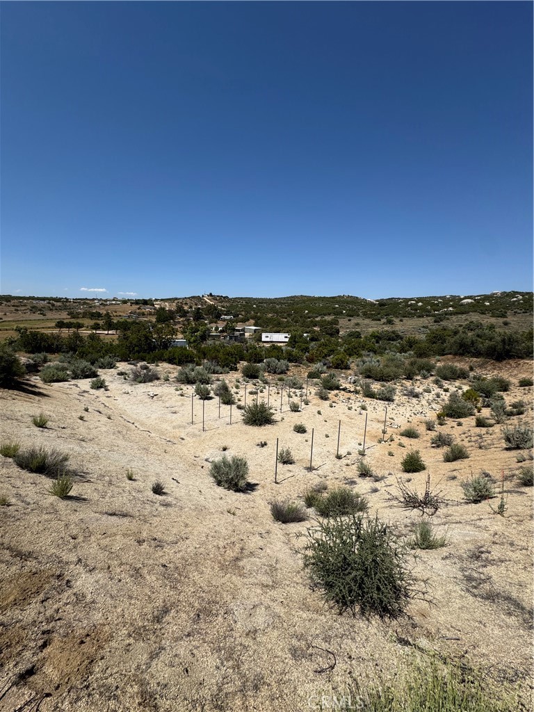TWO LOTS, A TOTAL OF 9.34 ACRES, MUST BE SOLD TOGETHER. A great opportunity to create your tranquil estate, winery, mini ranch, etc. This Land consists of a RV with AC, Big storage container, water, power, high lands and low lands. The southern parcel is sloping allowing wonderful valley views, the northern parcel is sloping to flat which allows for anything you might consider constructing in the area. This Area also offers 3 different lakes that are not more than 10-20 minutes away, for activities like fishing, etc.