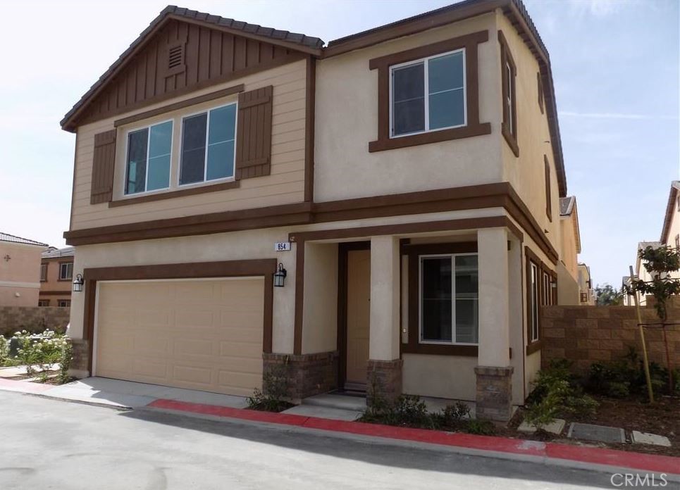BRAND NEW FLOORING AND PAINT JOB! This beautifully-designed home is located in the Magnolia Heights community within "The Colonies" neighborhood and is walking distance to nearby shopping centers, golf courses, schools, along with easy access to the 210 freeway. This charming 1,826 square foot home consists of 3 bedrooms and 2.5 bathrooms. Upon entering, you are greeted by a spacious entry with numerous large windows that let in beautiful, natural light to the family and dining room. The exquisite, open-concept kitchen has granite countertops with 6" backsplash, stainless steel appliances, and well-crafted dark wood cabinets. An intricate wood handrail next to the stairs leads you to the three beautiful bedrooms located upstairs. The huge master bedroom, with large windows, is well lit by natural sunlight along with recessed lights and is connected to the master bathroom with his and her sinks, quartz/stone countertops with 6" inch backsplash, towel racks, separate shower and tub, mirrored medicine cabinet, and large walk-in closet. The other two bedrooms have large windows and are located near the upstairs bathroom with a shower/tub combination, quartz/stone countertop with 6" backsplash, towel rack, and large mirror. The roomy, upstairs separate laundry room has washer and dryer hookups. Tying the whole home together is a versatile backyard with wood fencing for privacy and a two car attached garage. With a fresh coat of paint and brand-new wood flooring, this cozy, exquisite home will not last long and is a must see!