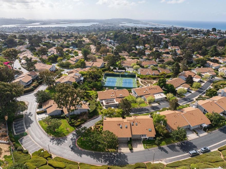 Set at the end of a private and serene cul-de-sac lies the rare opportunity to personalize one of the few fully detached units with idyllic views of San Diego and Mission Bay in the coveted 234-unit community of Mount La Jolla. This fully detached unit features a grand entry with high vaulted ceilings and floor-to-ceiling windows that drench the unit abundant natural light. Large windows and sliding glass doors line the entirety of the bottom floor taking full advantage of the beautiful views. Multiple patios wrap around the side and back for alfresco dining and sunset entertaining in Sunny San Diego. This unit has a large portion of outdoor space that could potentially be transformed into an even greater wrap-around patio complete with enough space for a beautiful private garden or yard, per HOA approval. The HOA has in fact allowed other units to absorb unused common areas for expansive outdoor space. The expansive primary suite offers a wall of glass and a private balcony to enjoy the gorgeous views from an even better vantage point. Finally, the property boasts a three-car attached garage complete with a wall of storage cabinets and room for even more storage while storing your vehicles. The community offers resort-style amenities including 4 pools (2 of which are heated year-round), 4 USTA tennis courts with lights, a fitness center with a stretching room, a spa and steam-saunas, a clubhouse with a fully equipped kitchen ready for larger parties and events, an inviting meeting room complete with a fireplace, a putting green, and walking trails lined with gorgeous lush landscaping throughout. All of this set atop a mountain just minutes from top-rated schools, beaches, dining and shopping in the Jewel of San Diego, La Jolla. This is a truly rare opportunity to enjoy coastal living at its finest!