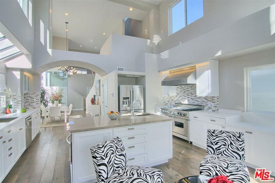 Welcome to Casa de Tecolotes, located 2 blocks to the ocean, in the heart of Ocean Park directly off Main Street, Rose, and on the border of Venice close to Abbot Kinney.  This sophisticated home has been completely remodeled with no detail left unattended & with no expense spared.  This private home has a tranquil backyard w/seating, heaters, a fountain & 8 ft. privacy walls w/original mural artwork by acclaimed local artist, Daniel Alonzo.  W/over 2500 ft. of multi-level indoor living, this spacious home has oak floors, Viking appliances, 3 fireplaces, master balcony overlooking Main St., new dual glazed windows, soundproof glass in master, new bath & kitchen cabinets replete w/sparkling new hardware.  Soaring 18-ft. ceilings lend to a layout that creates functional & simple beauty.  Magnificent sunlight makes this cheery home an upbeat workspace.  Oversized loft w/soothing natural light overlooks the living area.  Direct entry 2-car garage, w&d.