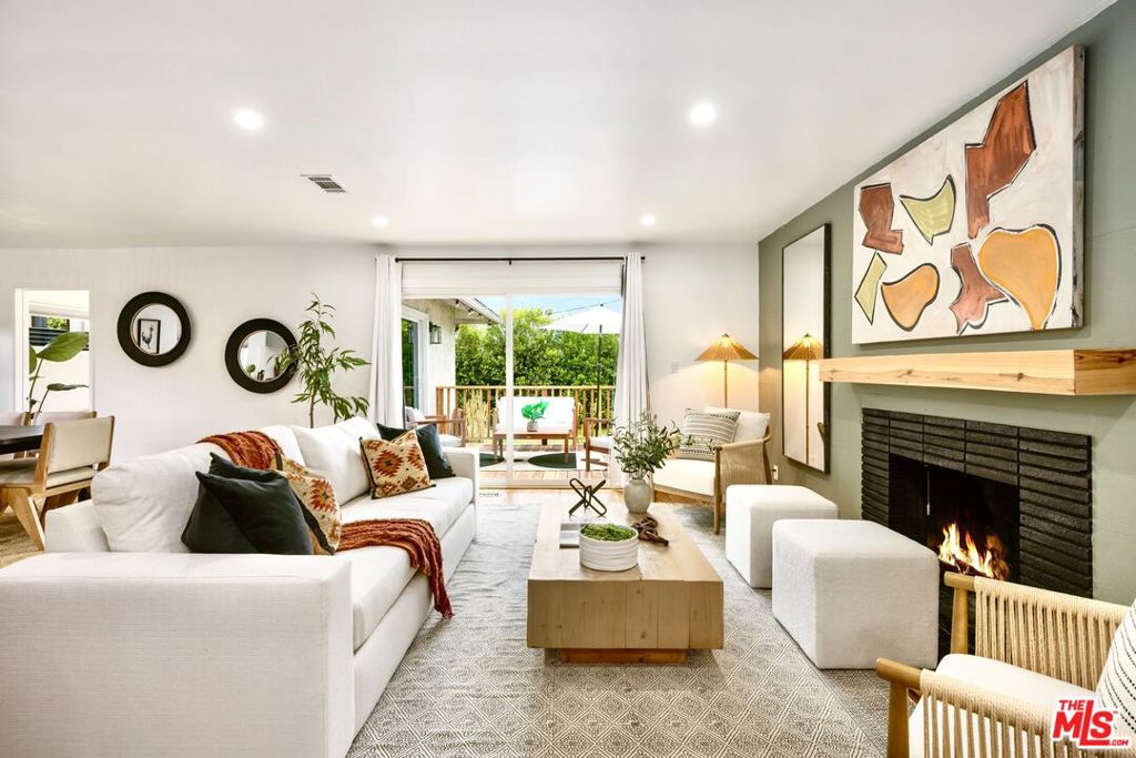 Welcome to your next dream home nestled near vibrant Jefferson Park! This beautifully reimagined 4-bedroom, 3-bathroom residence offers 1,624 square feet of bright, inviting living space on a generous, nearly 6,000 square foot lot. Step inside to discover a warm, open floor plan featuring refinished real hardwood floors that flow throughout. Natural light pours in through large double-pane windows by day, while soft recessed lighting creates a cozy, relaxing atmosphere by night. The heart of the home is a sleek, modern kitchen with quartz countertops, elegant flat-panel cabinetry, and all-new stainless steel appliances perfect for everyday living or entertaining guests. Stay comfortable year-round with a newly installed AC system. Outside, the spacious backyard is an entertainer's paradise ideal for family gatherings, summer BBQs, or simply relaxing under the stars. Spacious parking is available in the detached two-car garage, offering both convenience and functionality. Don't miss your chance to own this thoughtfully updated gem in one of LA's most up-and-coming neighborhoods. This is one you have to see in person to truly appreciate!