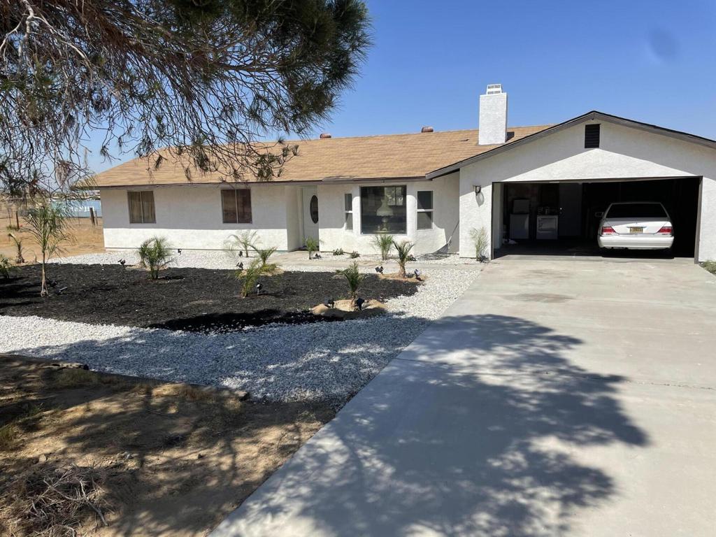 Welome to this beautifully redone ranch style home in Apple Valley Brand new kitchen flooring and bathroom with designer fixtures throughout the home.Outside you will find over 2,000 sq ft of turf the owner made a dog park in the back for there dog and over 25 beautiful canary palm trees...The 3rd bedroom is currently being used as a media room but can easily be converted back into a bedroom.