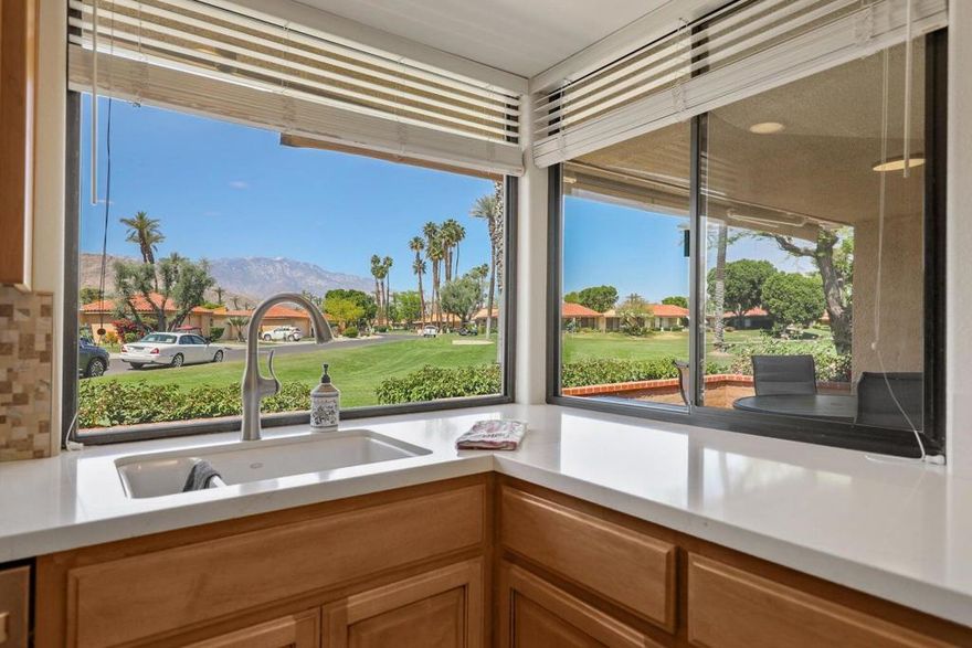 Stunning Golf Course & Mountain View Home: Thoughtfully Updated & Move-In Ready! Welcome to this beautifully upgraded, open-concept home ideally located with breathtaking golf course and mountain views. From the moment you walk in, you'll appreciate the attention to detail and quality finishes throughout.The remodeled kitchen is a chef's dream, featuring quartz countertops, a charming farmhouse sink, modernized cabinet and drawer faces, stylish backsplash, and stainless steel Whirlpool appliances. Enjoy morning coffee in the cozy breakfast bar, offering picturesque corner-window views.The spacious living and dining areas seamlessly flow together, perfect for entertaining or relaxing, all while taking in the scenic backdrop. A skylight brightens the updated den, making it the perfect space for a home office or reading retreat.The guest bathroom is tastefully refreshed with matching cabinetry, a sleek single vanity, and a tiled tub/shower combo with floor-to-ceiling tile. The guest bedroom offers comfort and style with an upgraded closet featuring built-in drawers.Retreat to the primary suite, where an updated walk-in closet with custom built-ins is a dream for any shoe collector. The luxurious en-suite bath includes a large step-in shower with elegant floor-to-ceiling tile, expansive dual vanity, and ample storage.Additional highlights include: handicap-accessible bathrooms, dual-pane windows and plantation shutters, tile flooring with carpeted bedrooms, plus baseboards for finished look, recessed, dimmable lighting, spacious laundry room with abundant storage, garage with custom built-in cabinetry, beautiful stone tile patio with retractable awning for year-round enjoyment.Sunrise Country Club offers secure, guard-gated living with 746 residential condos, an 18-hole Par 64 golf course, nine championship tennis courts, ten pickleball courts, twenty-one pools and spas, plus a clubhouse featuring a dining room, lounge, grille, pro shops, and a fitness/activity center. Two new bocce ball courts add to the recreational options. Located in Rancho Mirage--the heart of the desert--the community is close to top shopping, entertainment, and health facilities. Palm Springs International Airport is only 20 minutes away.This home offers not just comfort and functionality, but also a prime location and unbeatable views. A true gem--don't miss your chance to make it yours!