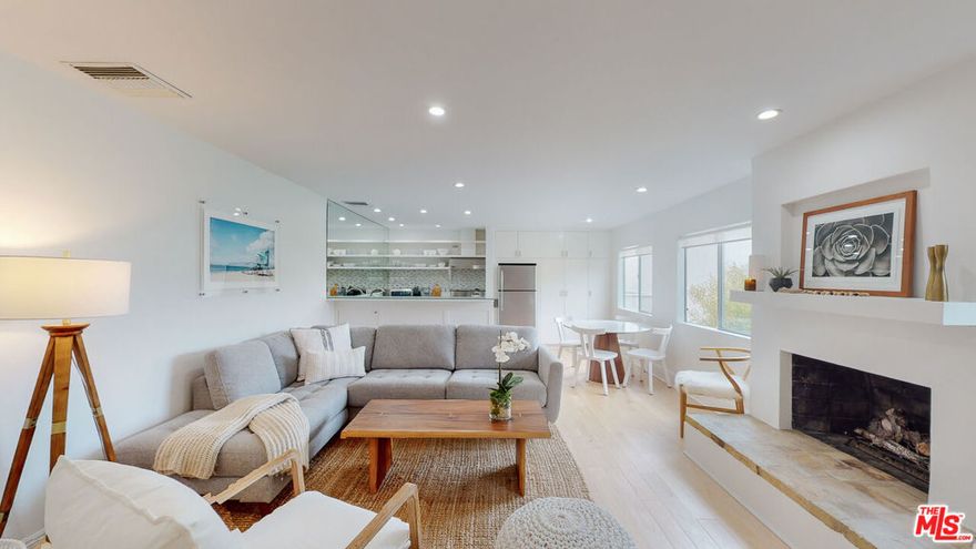 Step into coastal elegance with this sun-drenched, designer-remodeled one-bedroom, one-bathroom condo, ideally located on the sands of Malibu's coveted Carbon Beach. This top-floor residence boasts breathtaking natural light, open-sky views, and a seamless blend of modern luxury and coastal charm.The brand-new gourmet kitchen is a chef's dream, featuring high-end stainless steel appliances, a Thermador professional-grade stove, a Viking hood, and a dedicated wine refrigerator. The newly designed bathroom showcases stylish tilework and premium fixtures, while the custom-designed master closet offers exceptional storage solutions. Gorgeous hickory whitewashed hardwood floors extend throughout the space, complementing the warmth of a gas fireplace. Additional floor-to-ceiling built-in storage adds both functionality and sophistication.The complex itself is a private oasis, complete with an ocean-facing heated pool, communal BBQ areas, a newly remodeled lobby, an elevator, and secure gated entry. Enjoy direct beach access, covered garage parking, and effortless proximity to Malibu's finest restaurants, high-end boutiques, a health club, a movie theater, grocery stores, and the iconic Malibu Pier.Surrounded by multi-million-dollar oceanfront estates and lush landscaping, this exclusive retreat offers a rare opportunity to experience the best of Malibu beachfront living. Designer furniture may be available for purchase.Don't miss your chance to own a piece of paradise on Billionaire's Beach!