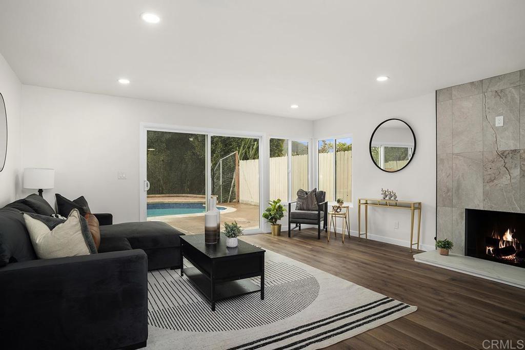 Incredible opportunity to own this gorgeous, contemporary fully updated home! It features 4 bedrooms, 3 full baths, and open concept. The sweeping canyon view is breathtaking. Add new landscaping, pergola & luxurious pool upgrades. Inside features a masterful remodel for multigenerational living or elevated hosting. Situated in the highly desired Poway school district. This is a beautiful home.