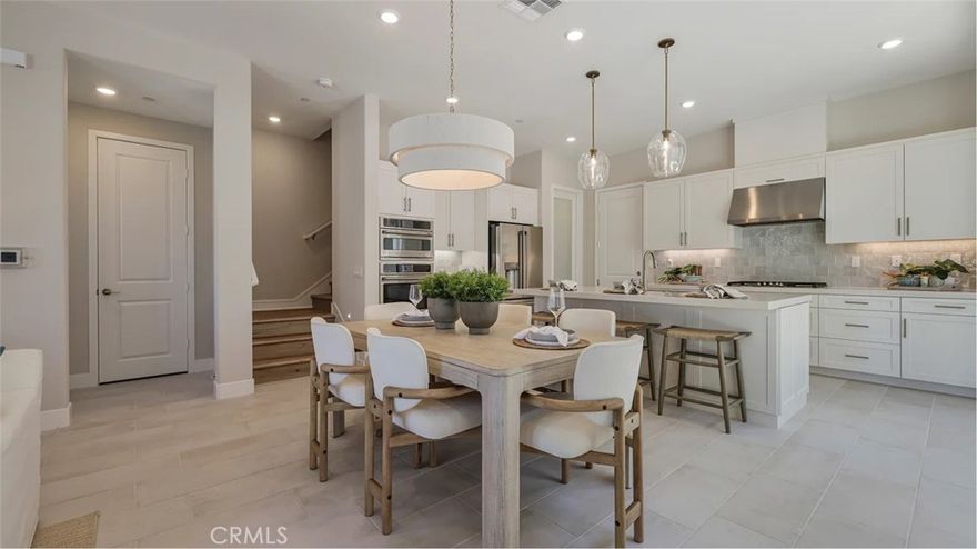 Ruby Plan 1 by Lennar offers 1,976 sq. ft. of thoughtfully designed living space. This two-story, 3-bedroom, 2.5-bath paired home with a 2-car garage features a spacious open-concept kitchen, dining, and great room on the main level, ideal for everyday living and entertaining. The owner's suite includes a private bath with dual sinks and a generous walk-in closet. All three bedrooms are located upstairs, along with a versatile loft and a conveniently placed laundry room. Situated in Valencia's master-planned community, residents enjoy access to pools, parks, scenic trails, and more.