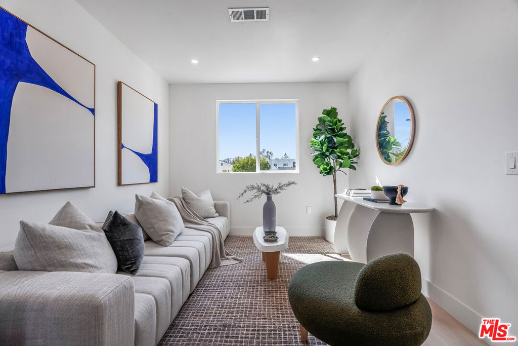 Your golden opportunity to enter homeownership in one of Los Angeles' most rapidly appreciating and design-forward neighborhoods has arrived. Introducing "The David II", a newly constructed 3-bedroom, 2.5-bathroom townhouse located within a 3-unit boutique new construction community near the Culver City Arts District. The open-concept floor plan seamlessly connects the modern kitchen, dining, and living areas, creating a fluid space ideal for entertaining or everyday living. Upstairs, three comfortable bedrooms offer flexibility and privacy, including a tranquil primary suite with en-suite bath. Interior highlights include wide-plank flooring, custom cabinetry, designer surfaces, and abundant natural light throughout. Additional features include side-by-side covered parking for two cars and all the benefits of brand-new construction. As a Senate Bill 8 (SB-8) exempt property, this offering is not subject to rent control, providing future owners the flexibility to rent the home without restrictions, an increasingly rare advantage in Los Angeles. Located just minutes from Erewhon, Destroyer, the Helms Bakery District, and major tech and media employers such as TikTok, Google, Sony, and Amazon Studios, this home offers a lifestyle of convenience and long-term investment appeal. This is a TIC sale requiring TIC-specific financing or an all-cash purchase. Contact the listing agent for lender referrals and further details.
