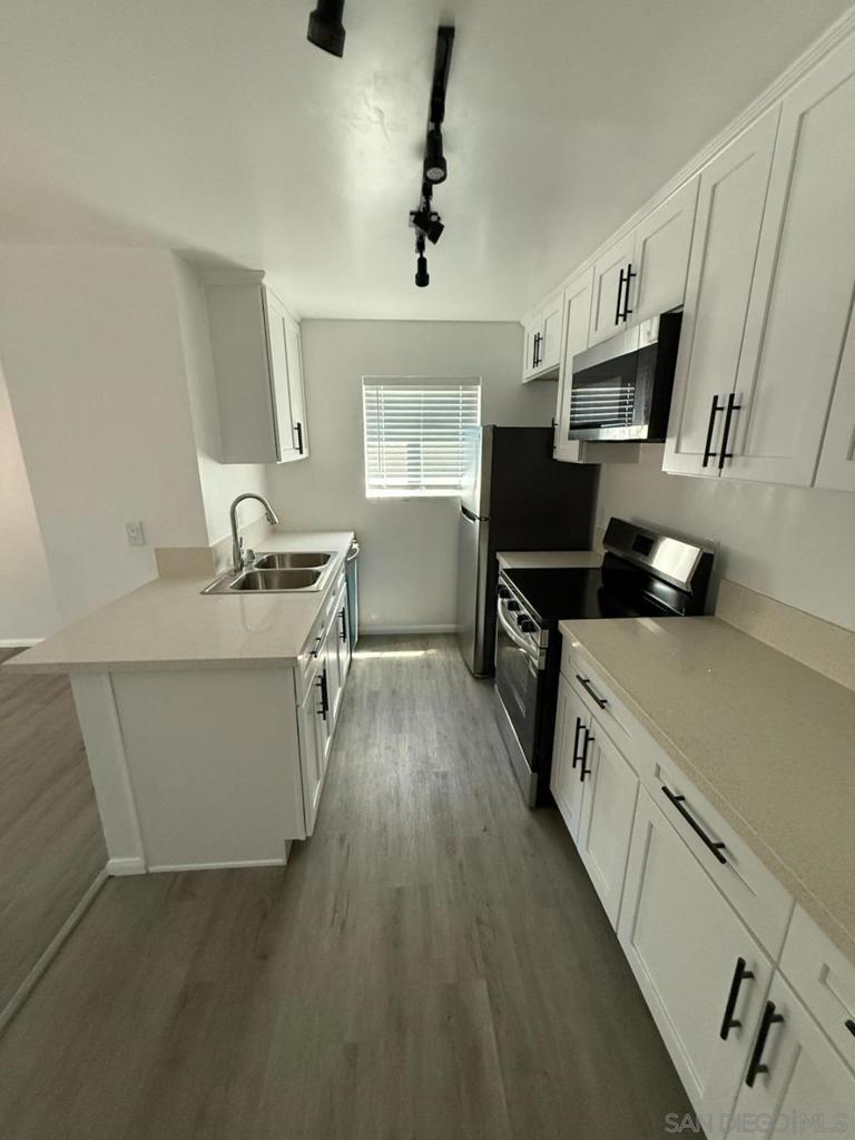 Newly remodeled turnkey condo in the College area. Corner unit on the 2nd floor with nobody above you. Upgrades include: new stainless steel appliances, quartz counters in kitchen and bathroom, dual pane windows throughout, new lighting, wall ac and heat and luxury vinyl flooring. Conveniently located across the street from the Joan Croc Center, open to the public. Get a day pass and use the pool, gym, pickleball and basket ball courts! Steps to shopping and public transportation. Approximately 3 miles to SDSU.