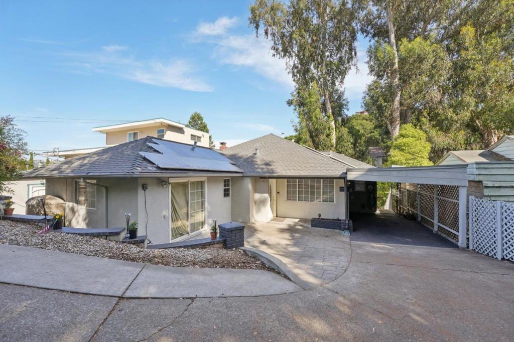 Get Paid to Produce Power Beautiful 4-Bedroom Home in Castro Valley Hills! Nestled in the desirable West Castro Valley Hills, this energy-smart single-family home offers 2,109 square feet of thoughtfully designed living space. Located just steps from top-rated Stanton Elementary and within a community known for its excellent schools, this 4-bedroom, 3-bath residence is ideal for families and future-minded homeowners alike. A standout feature of this property is its generative potential an in-law unit with a separate entry offers excellent income-producing possibilities. The home also boasts power generation, featuring a wholly owned 25-panel solar system mounted on an only 7-year-old roof, which provides enough energy for a family of four and earns credits for excess production. Already wired for an electric vehicle, this is a true turnkey green home. Outdoor living shines with a 10x20 sunroom situated above a beautifully restored lower redwood deck, perfect for entertaining or relaxing. The exterior has been freshly painted, and both decks have been refinished and sealed. Inside, the two upstairs bathrooms have been partially remodeled within the past year. The upper level has also been repaired and freshly painted, and the home has been fumigated for added peace of mind.