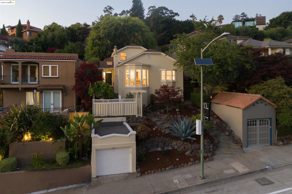 Located in the heart of Upper Rockridge, this lovely 3 bedroom, 1 bath traditional home boasts incredible views and a large back yard. Enter to light filled spaces, hardwood flooring and comfortable style. The living room with fireplace features lovely bay windows. The adjacent dining room is the perfect place for family meals. The kitchen, with stainless steel appliances, pantry and granite counter tops will delight any home chef. 2 ample bedrooms and a full bath complete this living level. Upstairs, another large bedroom overlooks the large rear yard. An oasis all its own, the yard meanders to a large deck that overlooks San Francisco and the Bay. A lovely spot for outdoor entertaining, morning coffee, gardening, play or room to roam for man's best friend. Close proximity to Lake Temescal, Hillcrest School and the Terrace Coffee shop and moments from all that the East Bay has to offer, 6314 Broadway is the perfect place to call home.