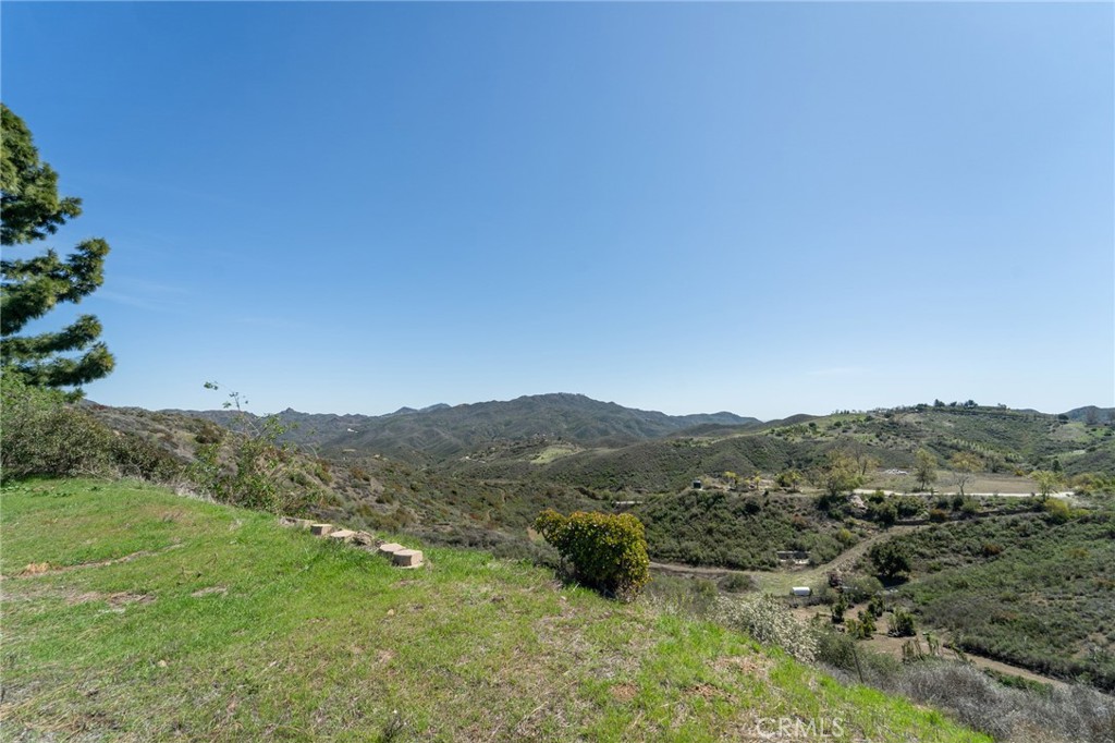 Exceptional opportunity to own a 39,784 sq ft (.9133 acres) Woolsey Fire Burn Out lot in one of the most desirable areas of the Malibu Hills. Enjoy stunning mountain views and a peaceful setting just minutes—less than a 10-minute drive—from the beach. With a generous amount of usable, buildable land, this property is perfect for creating your dream estate in a coveted coastal location. Don’t miss this rare chance to build in Malibu.