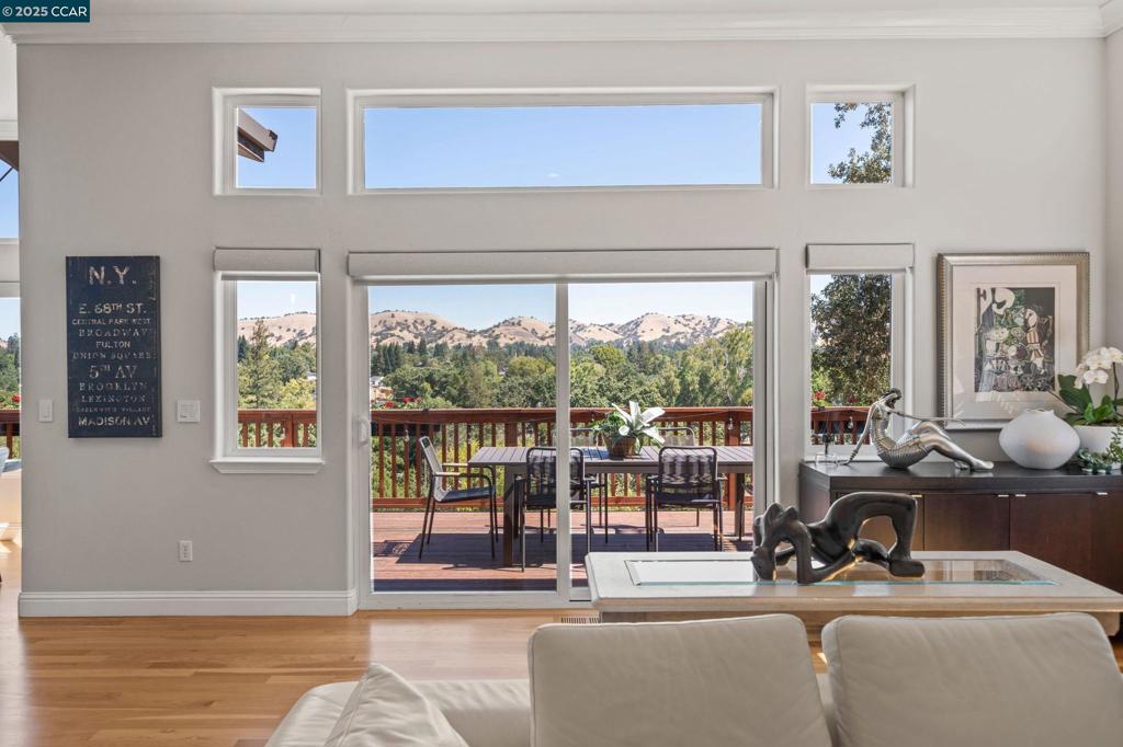 Same incredible views....new great price!! Unparalleled privacy, sweeping views, and sophisticated design await in this beautifully remodeled modern retreat at the end of a quiet private lane. Set on 1.16 acres with unobstructed views of Mt. Diablo, this home blends elegance with livability. The main level features a formal living and dining room, statement office, and chef’s kitchen with ceiling-height custom cabinetry, Thermador appliances, Miele dishwasher, built-in wine fridge, and a spacious island—opening to a full-length view deck perfect for entertaining. The luxurious primary suite boasts a spa-like bath with Calacatta marble, Victoria & Albert soaking tub, illuminated mirrors, and a custom California Closet. A lower-level guest suite and family room offer private access, a second deck, and flexible living options. Outside, enjoy a wisteria-covered arbor, a hardscaped patio, flat lawn, and room for a pool. Additional upgrades include hardwood floors throughout, new HVAC, LED lighting, motorized shades, app-controlled irrigation, and landscape lighting. Minutes to downtown WC, top schools, BART, and major hospitals.