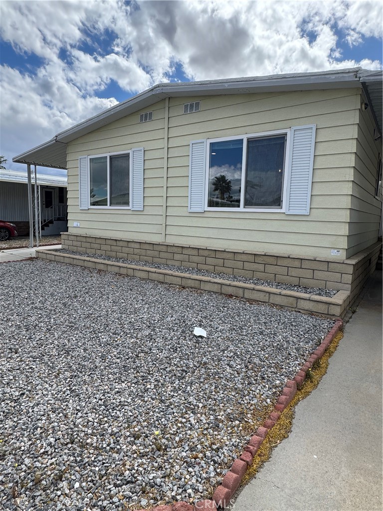 Now available for lease in the Sky Haven Home Park a gated 55+ community, this 2 bedroom, 2 bath manufactured home in Desert Hot Springs offers comfort, space, and convenience. The open concept main living area features easy-care laminate flooring, large windows that fill the space with natural light, and a dedicated dining area perfect for everyday living or entertaining. The kitchen is well-equipped with a gas stove, dishwasher, ample cabinet storage, generous counter space, a full tile backsplash, and a large central island for added prep and gathering space. The guest bedroom is well proportioned and has direct jack-and-jill access to the guest bathroom, which includes tile flooring and a walk-in glass shower. The primary bedroom is spacious and private, featuring an attached bath with its own walk-in glass shower and additional built-in storage for added functionality. This home is available furnished or unfurnished, making it a flexible option to suit your needs. Located in a well-maintained community with easy access to nearby amenities and major routes, this lease opportunity blends everyday practicality with desert charm.