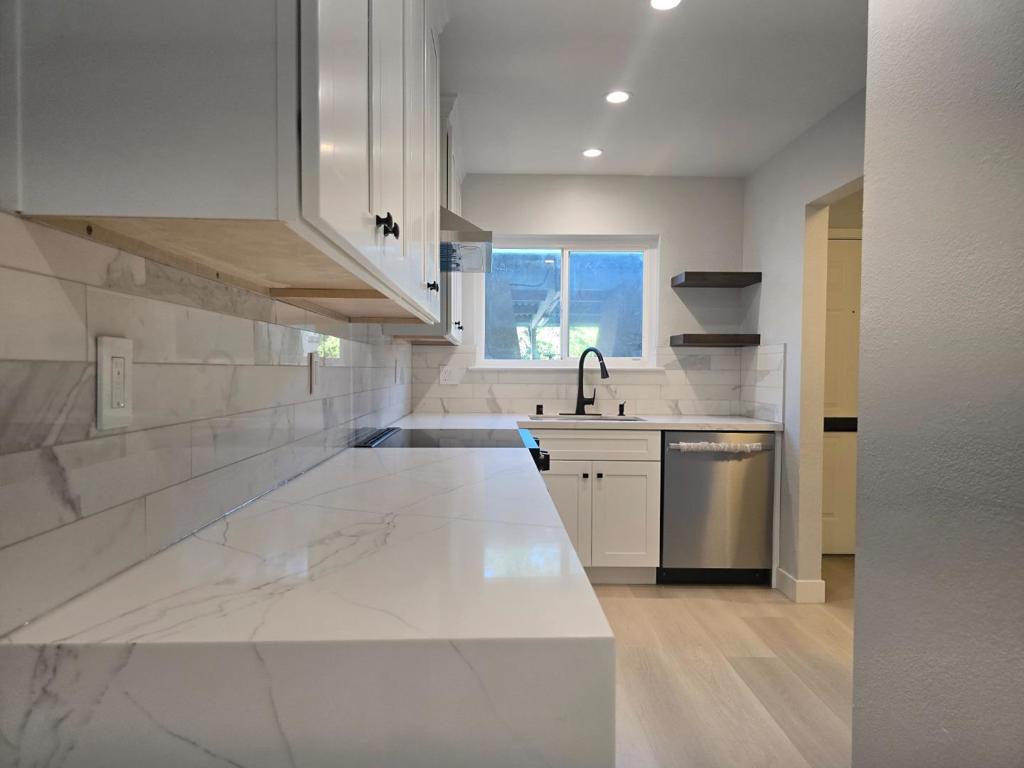 Welcome to this charming 2-bedroom, 1.5-bathroom home located in the heart of Santa Clara. With a spacious 954 sq ft layout, this residence offers a blend of comfort and functionality. The new kitchen is thoughtfully designed with modern amenities including a quartz countertop, dishwasher, exhaust fan, and garbage disposal, The kitchen design with a space for washer and dryer 2 in 1 to ensuring convenience for everyday living. Totally replace new bathrooms with Kohler bathtub, Hansgrohe faucets, Woodbridge toilets and Samsung appliances. The home features a walk-in closet, providing ample storage space. new Vinyl Flooring throughout the house includes durable tile in bathroom and easy-to-maintain vinyl/linoleum. The cozy living area is complemented by a new wall furnace on 2nd floor for heating. The community offers a pool as a refreshing retreat during warm months. The property falls under the Santa Clara Unified School District. This home offers a practical and comfortable living environment in a prime location.