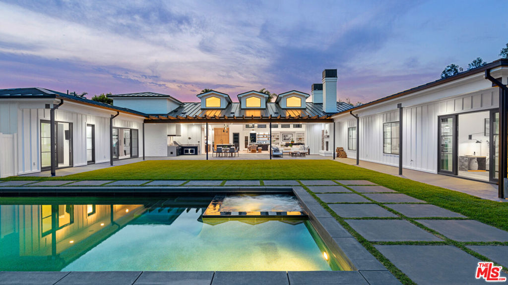 The Malibu Surf Barn: A rare, all-encompassing Point Dume retreat where a mostly flat acre of private land meets deeded access to two of Malibu's most exclusive sandy coves. With dual gated private entries to Little Dume beach via Riviera 1 and Paradise Cove's "The Hut," this 2020-built estate offers unmatched privacy, scale, and a beachside experience rarely ever available at this price point. At the heart of the home, a soaring great room with 18-foot tongue and groove vaulted ceilings, a 5-foot Isokern fireplace, and oversized Fleetwood glass pocket doors opens seamlessly to the outdoors. Entertain effortlessly from the chef's kitchen, featuring top-tier appliances, a grand island, and an impressive wine fridge. Outside, the grounds have been meticulously landscaped and curated for everyday enjoyment and entertaining - complete with a pool and spa, picturesque oak grove, fully outfitted and heated covered patio with fireplace, built-in Heston BBQ, audio system, outdoor shower, surf shed, and a 4x4 vehicle for easy access down your private trail to the beach. One wing of the home boasts a spacious primary suite with garden views, a resort-style spa bathroom, and a custom walk-in closet with Caruso jewelry safe. Two additional en-suite guest bedrooms open to private patios, while the opposite wing features a media/game room and a versatile fourth en-suite bedroom or office. Private walkway access to Little Dume, combined with deeded access via a gated, paved road, is a rare privilege reserved for only a handful of Malibu's most premier properties. This is a one of a kind opportunity to own an immersive Malibu beach retreat at this level of value and exclusivity.