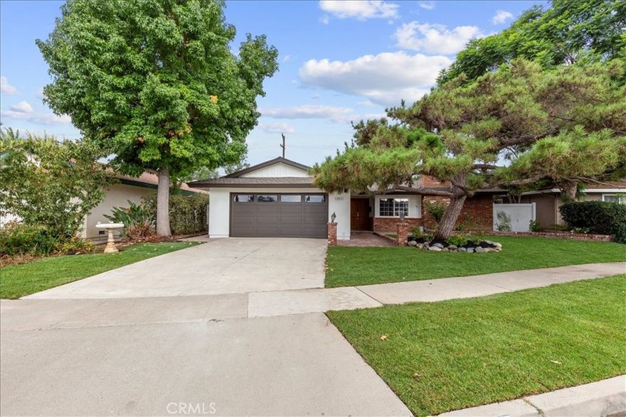 Welcome to this beautifully remodeled ranch-style home tucked in a quiet cul-de-sac in Tustin, thoughtfully reimagined by Battres Construction Design Build, celebrated for their work on HGTV. From the moment you arrive, the fresh landscaping with new sod, plants, and upgraded irrigation creates an inviting curb appeal.

Inside, the open-concept design offers 4 bedrooms, 2 bathrooms, and 2,255 sq. ft. of living space on a 7,296 sq. ft. lot. Enter through double wood doors to a spacious entry, to the right, a bonus 4th bedroom with wall-to-wall closet and cozy smooth finish fireplace. To the left, the dining area flows into the gourmet kitchen with sleek white oak cabinetry, quartz countertops, modern tile backsplash, and brand-new stainless-steel appliances, including refrigerator, dishwasher, hood range, and microwave. Throughout the home, new luxury vinyl plank flooring adds warmth and durability.

Off the kitchen, a huge great room with soaring beamed ceilings, remote ceiling fans, smooth-finish fireplace, and a slider door leads directly to the backyard pool retreat. The primary suite features a spa-inspired bathroom with frameless glass shower, dual vanities, designer tile finishes, and a slider to the pool area.  The guest bath is equally upgraded with quartz counters, modern fixtures, and elegant tile work. All bedrooms include mirrored closet doors.

Outdoors, enjoy resort-style living with a replastered heated pool and spa with new equipment.  Included are a new 3-piece BBQ and multiple entertaining areas. Additional highlights include solar panels, central A/C, newer dual-pane windows and plumbing, a new 200-amp breaker box, fresh interior/exterior paint, new baseboards and casings, new remote ceiling fans, updated laundry space, and a two-car garage.

Blending quality craftsmanship, thoughtful upgrades, and a prime cul-de-sac location, this move-in ready home is the perfect balance of indoor comfort and outdoor lifestyle, an exceptional opportunity in Tustin!