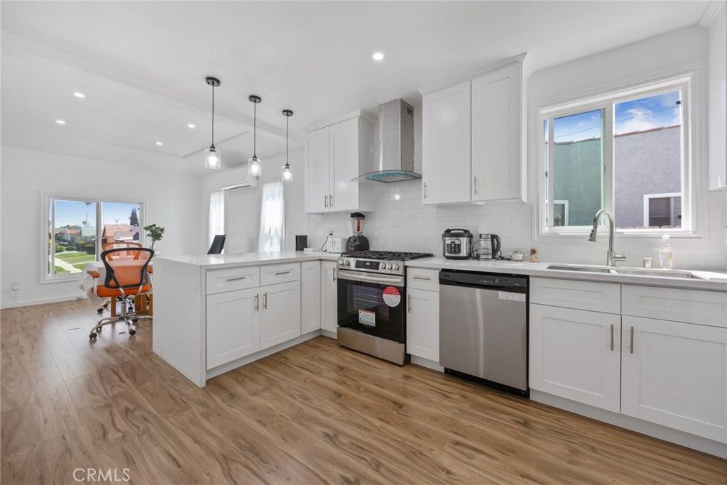 Photo of 7037 Cimarron Street, Los Angeles, CA 90047 (MLS # DW26005307)