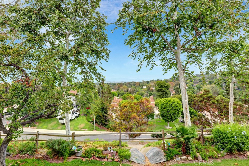Welcome to Laguna Woods 55 plus community, this 2 bedroom 2 bath has upgrades and a wonderful view of city lights, mountains and tree view like your in a tree house. Convenient to Laguna Beach, shopping close by, hospitals and doctors close as well. Come and enjoy this very active community that has 27 hole golf course, par 3, pickleball, 3 gyms, 5 pools, and 7 clubhouses with arts & crafts plus performing arts theater. Over 250 social clubs.