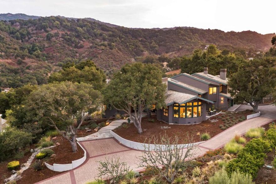 Set behind gates, this 4-bed, 3.5-bath estate offers privacy, beauty, and exceptional craftsmanship on over an acre. An extended driveway leads to its elevated position, where panoramic views of the western hills and SF Bay unfold in every direction. Designed by architect Robert Peterson and built by Drew Maran Construction, the home pairs sustainability with livable luxury and sophistication. Soaring ceilings and bold walls of glass fill the interiors with light and frame the views throughout. A harmonious floor plan includes expansive gathering spaces, a chef's kitchen with top appliances, and a walk-out family room, with a wine cellar, office, and multiple fireplaces adding comfort and functionality. The primary suite spans the entire upper level, while three additional bedrooms offer space for family and guests. Outside, enjoy a spa deck, new lawn, and screened-in porch, all just two miles from the Los Altos Village and served by top schools (buyer to verify eligibility).