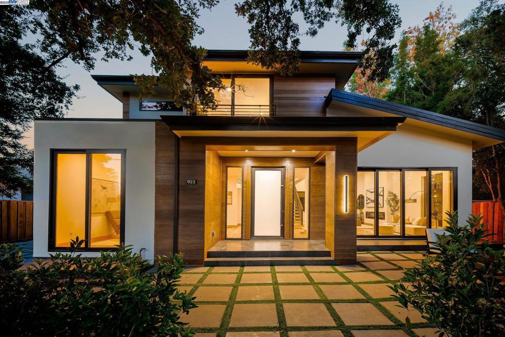 Ultra-Modern 2025 Masterpiece on a Peaceful Cul-de-Sac Near Stanford & Downtown Palo Alto. Tucked away on a tranquil cul-de-sac in coveted Barron Park, this brand-new 2025 north-facing showpiece blends striking architecture and luxury finishes—minutes from Downtown Palo Alto, Stanford, and award-winning schools. The cedar-accented façade and contemporary lines signal this is no ordinary home. Inside, soaring ceilings, floating staircase, and wide-plank oak floors bathe in natural light. The main residence offers 4 bedrooms—all with en-suite bathrooms—including a downstairs bedroom, while the fully permitted 2-bedroom ADU provides full kitchen, living room, and private entrance—perfect for guests or income potential. The chef's kitchen features Thermador appliances, book-matched stone countertops, and dramatic backsplash. Massive 8-foot sliding doors open to both private backyard and front-yard outdoor living room under a majestic oak. Upstairs, the luxurious primary suite boasts spa-like bath and custom walk-in closet. Additional highlights include sitting room, tiled patio, and 10-year builder warranty.