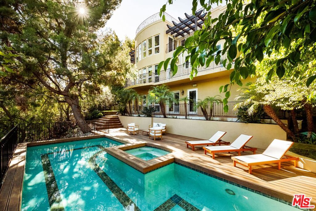 Tucked away in the serene canyons of Beverly Hills, this tranquil residence embodies the essence of California living where privacy, nature, and understated elegance meet. Surrounded by mature trees and peaceful canyon views, the home offers a sense of calm that feels worlds away yet remains only moments from the city's premier shopping and dining. Light-filled interiors flow effortlessly to the outdoors, creating a seamless connection between the living spaces and the natural surroundings. The inviting pool and sun-drenched terrace provide a private sanctuary for relaxation in the spa or dining al-fresco, framed by the quiet beauty of the hills and the morning sunrise on the canyon is spectacular. Adding to its appeal, residents enjoy exclusive access through the Bowmont Estates gates, offering a convenient route up to Mulholland Drive and easy connectivity to the Valley, a distinctive amenity that enhances both privacy and accessibility. An exceptional offering in one of Beverly Hills' most desirable settings, 2505 Bowmont Drive is a retreat of timeless comfort and effortless sophistication - a place to unwind, recharge, and experience true tranquility.