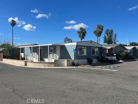 Photo of 4901 Green River Rd #104, Corona, CA 92878 (MLS # OC26088066)